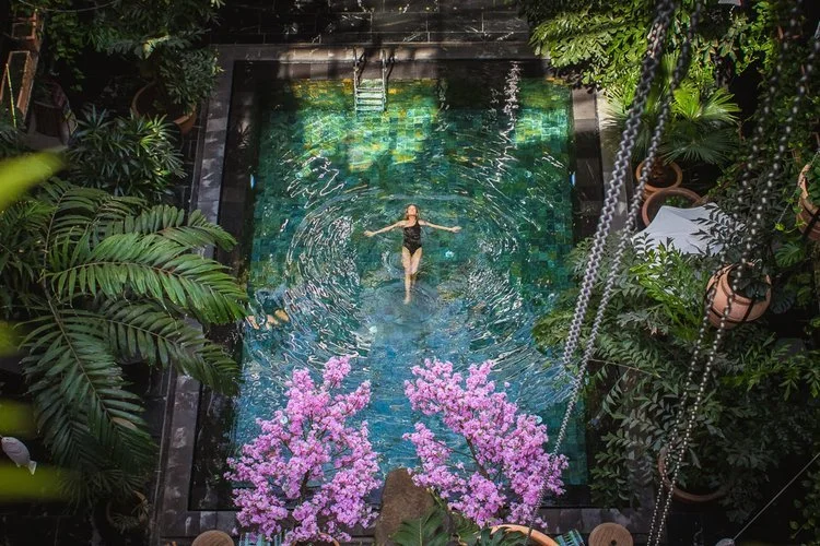 The old Copenhagen building that now houses Manon Les Suites was previously a hotel. But the transformation into tropical oasis goes far beyond a renovation and can truly be seen as adaptive reuse at its most organic.