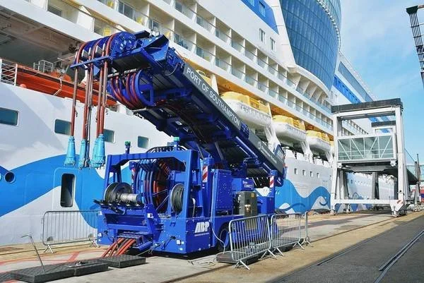 AIDA Cruises uses shore power technology, allowing their ships to connect to the local electrical grid while docked instead of running their engines. When a ship is connected to shore power, it can shut down its engines, resulting in a significant re