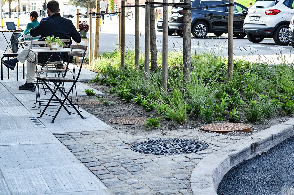 Climate Tile by Tredje Natur is a tile with small holes that allows water to flow underground into man-made aquifers. Stored water can be used to irrigate plants lining urban pathways.