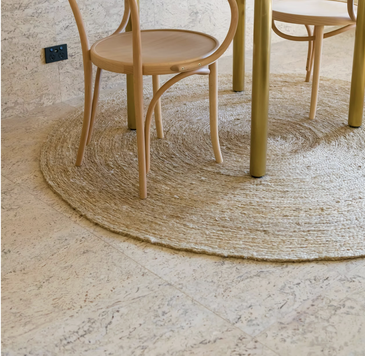 CORK FLOORING is the epitome of eco-friendly design, seamlessly blending sustainability with style. Crafted from the bark of cork oak trees, this natural wonder offers a myriad of benefits. Its inherent resilience absorbs impact, making it ideal for 