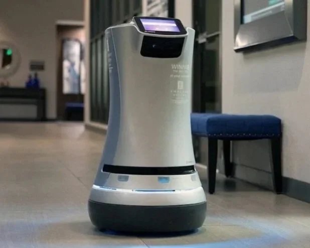 Relay by Savioke is an autonomous delivery robot widely used in hotels to transport items such as towels, snacks, toiletries, and room‑service orders. The robot navigates hallways, uses elevators, and delivers items contactlessly, reducing staff work