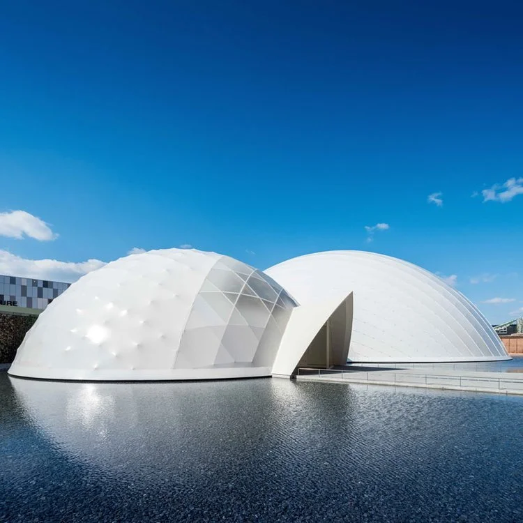 Blue Ocean Dome is made of CFRP tubes, which have been used in airplane and car bodies but not yet as a main structure in architecture. The sub-domes use a paper tube structure made of recycled paper and laminated bamboo, developed for the first time