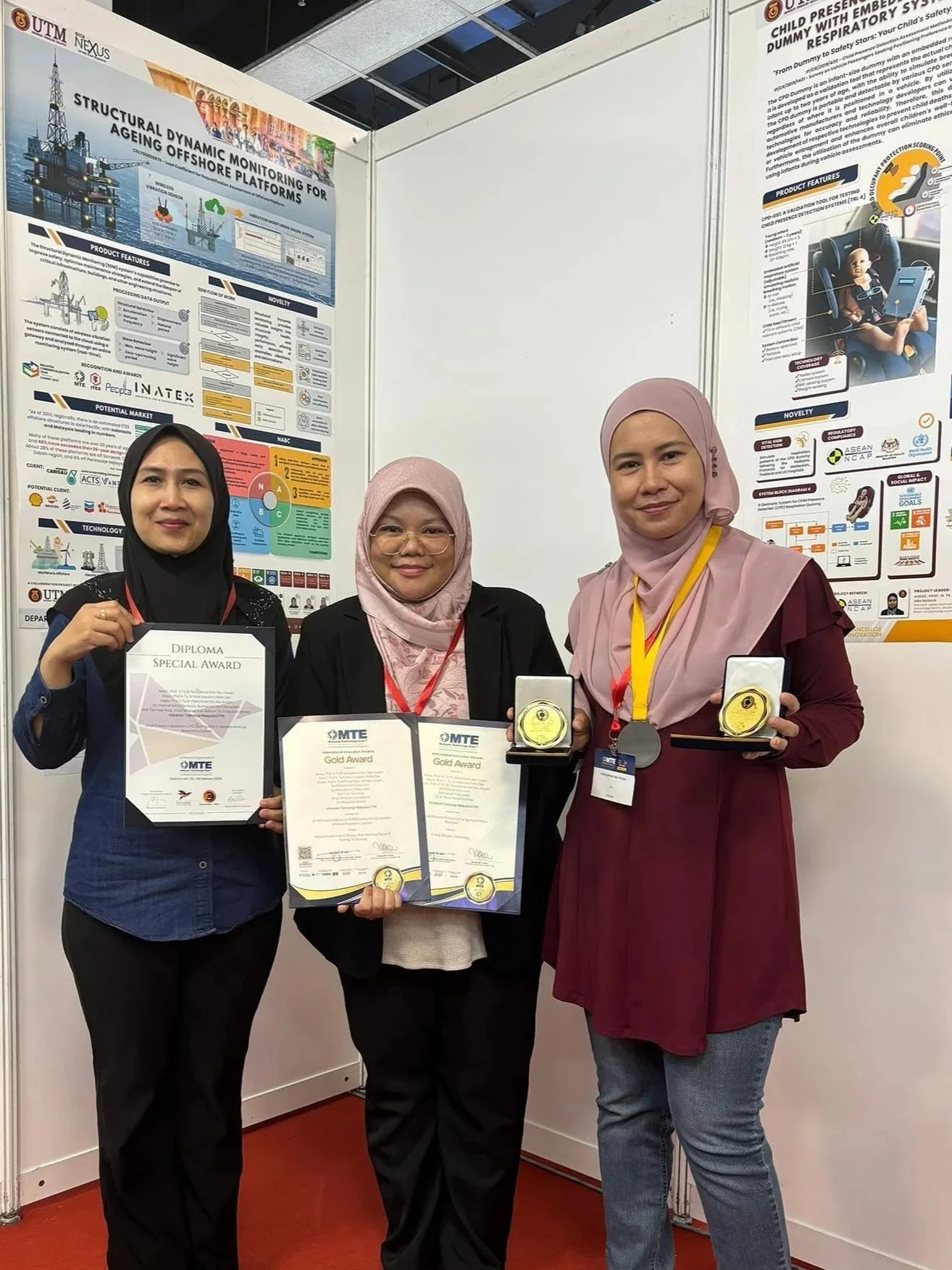 UTM–ACTS representatives displaying Gold Award certificates, medals, and a Special Award at Malaysia Technology Expo (MTE) 2024, recognising innovations in Child Presence Detection (CPD) and Structural Dynamic Monitoring (SDM).
