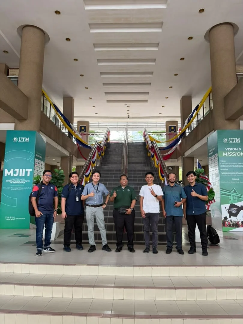 Group photo of UTM, ACTS, and ORS Technologies representatives at the UTM Malaysia-Japan International Institute of Technology (MJIIT) campus during a collaborative engagement for an offshore structural Digital Twin research project.