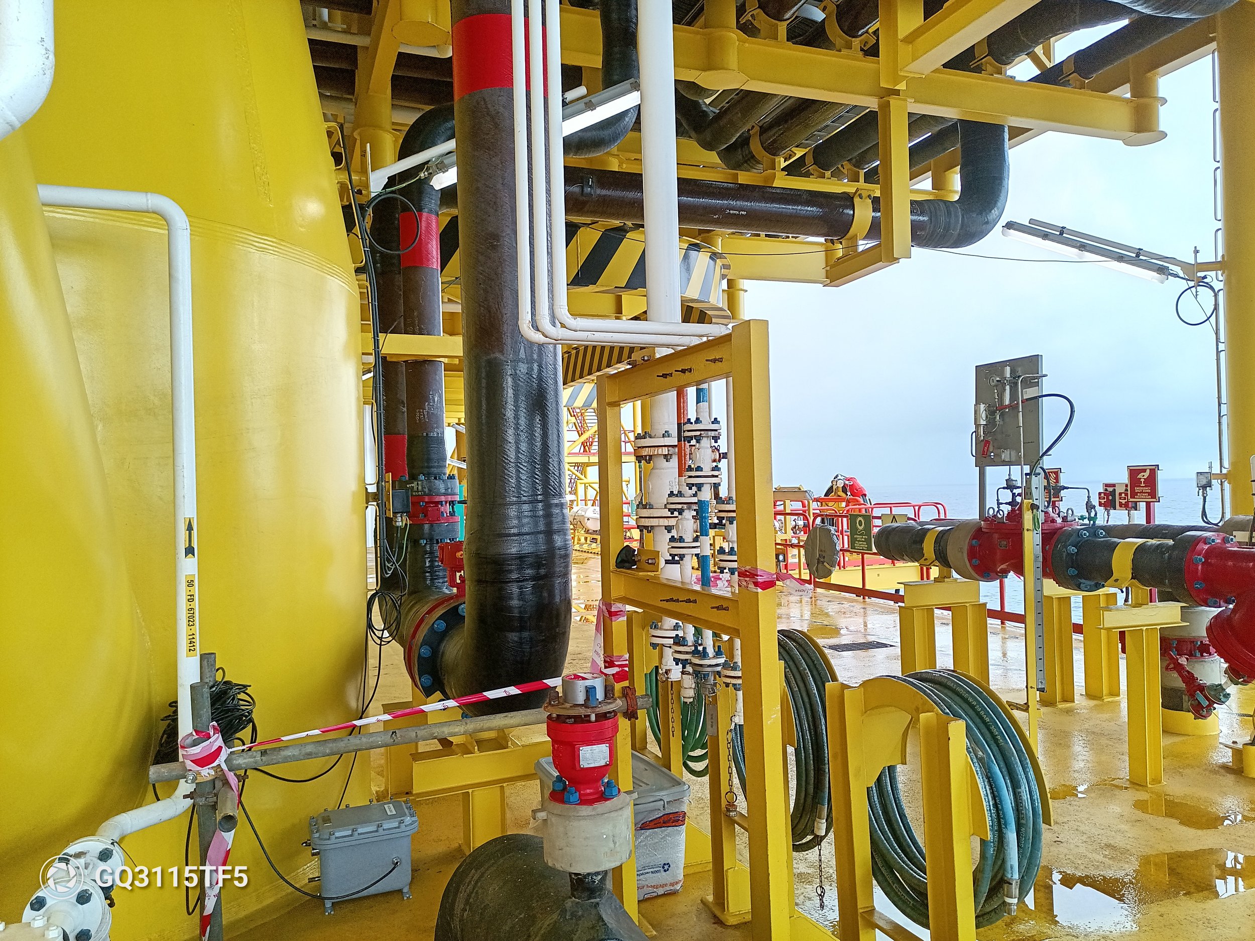 On-site structural dynamic monitoring activities at an offshore oil and gas platform, featuring installed instrumentation, piping systems, and structural components.