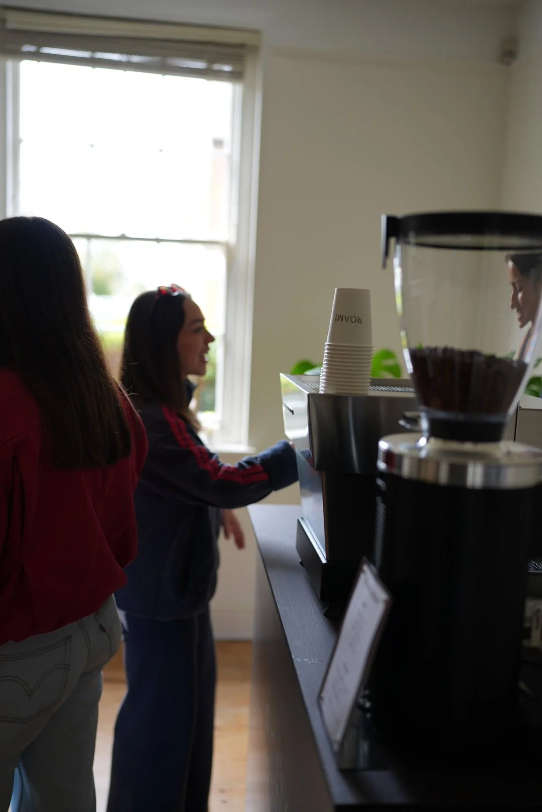 People gathering around the coffee cart