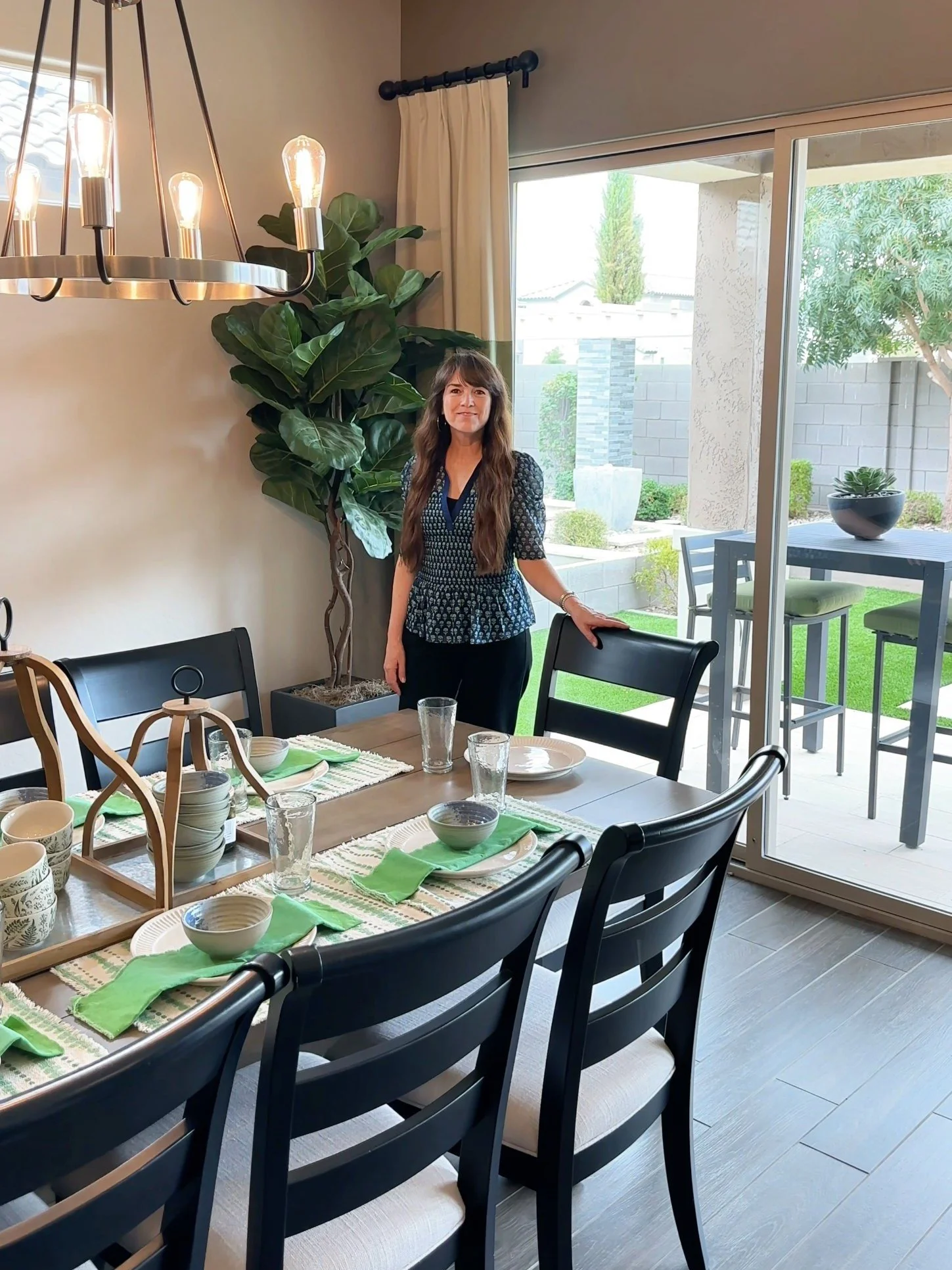 Catherine Wright, Gilbert REALTOR®, in a staged dining room with a set table