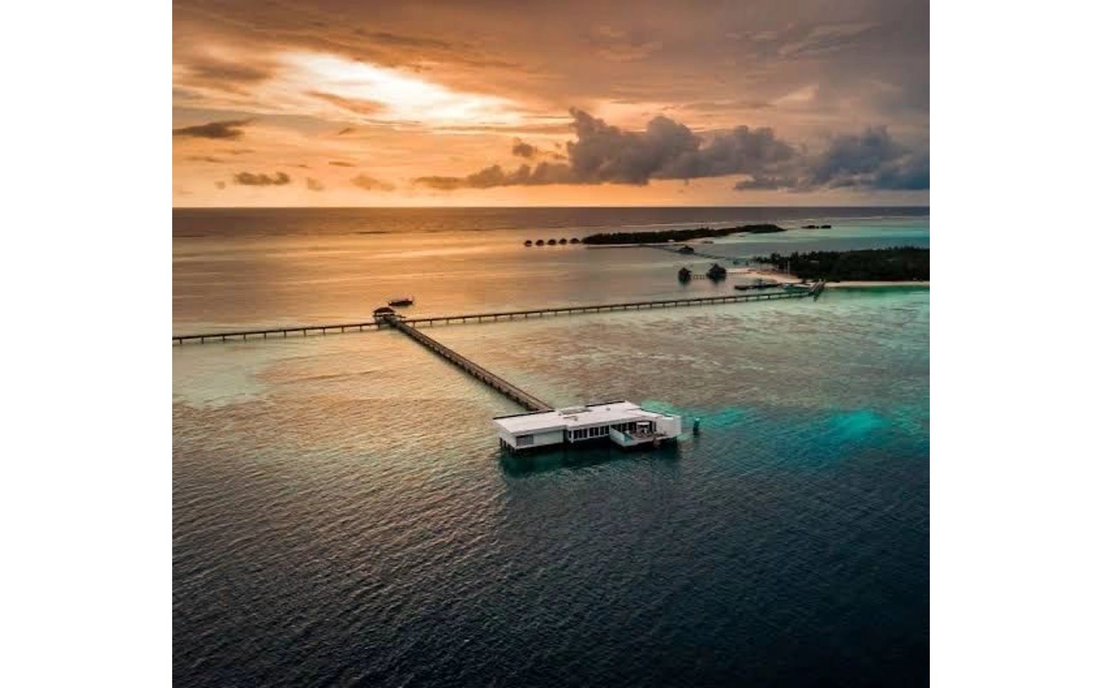 Maldives overwater villa at sunset, Conrad Rangali Island