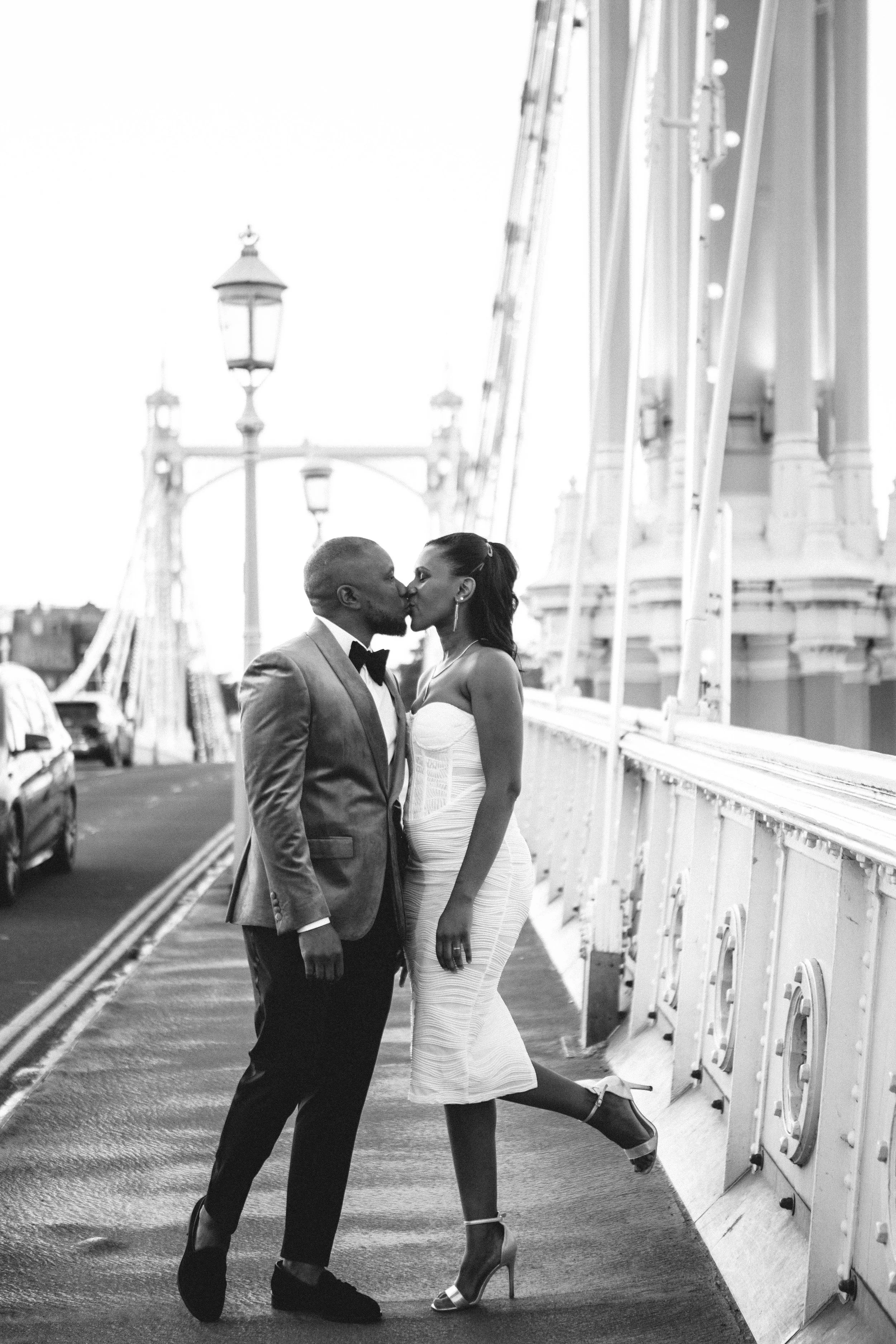Couple kiss during their pre-wedding photography session in Battersea