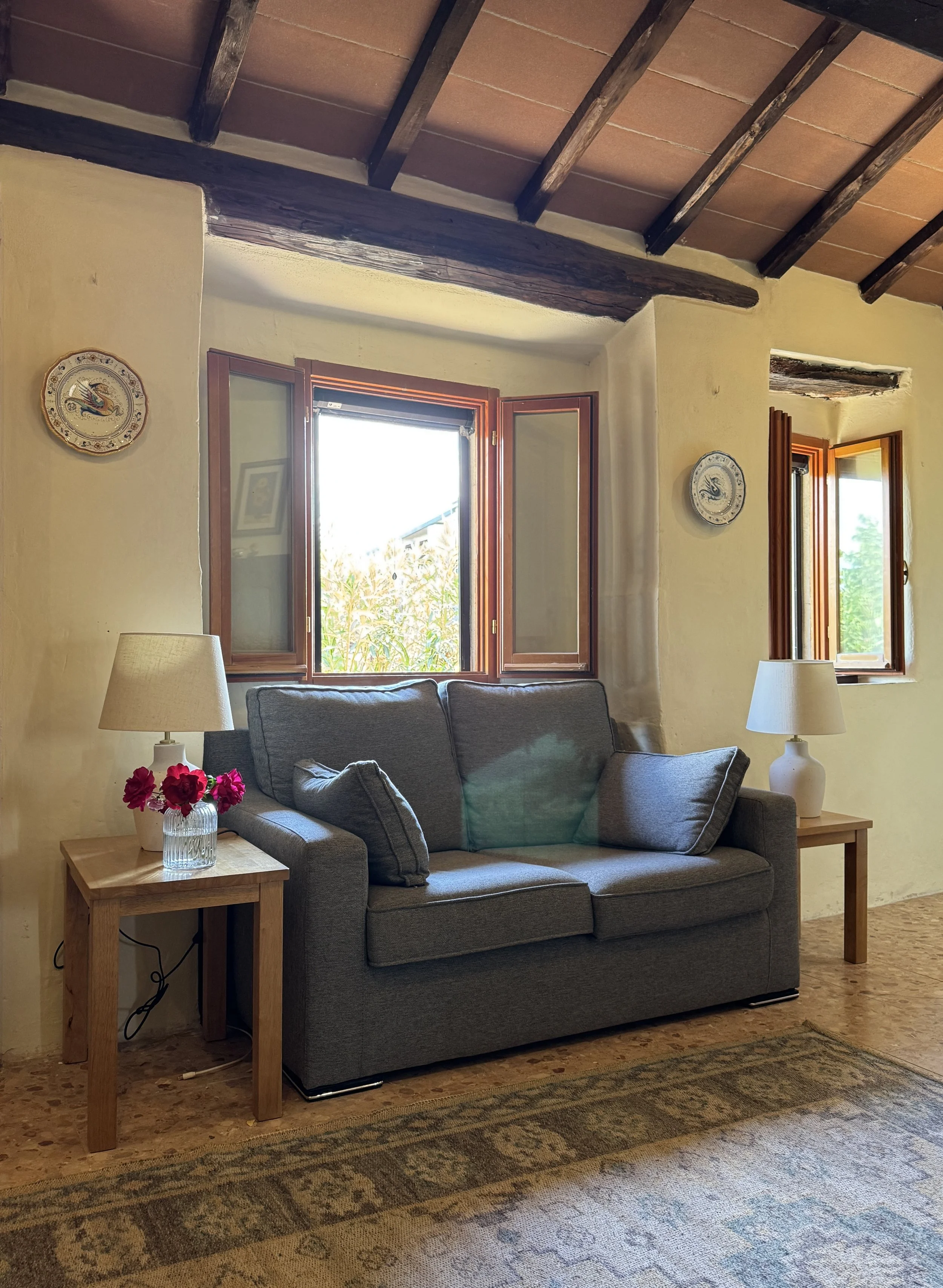The small sofa is a great place to read a book