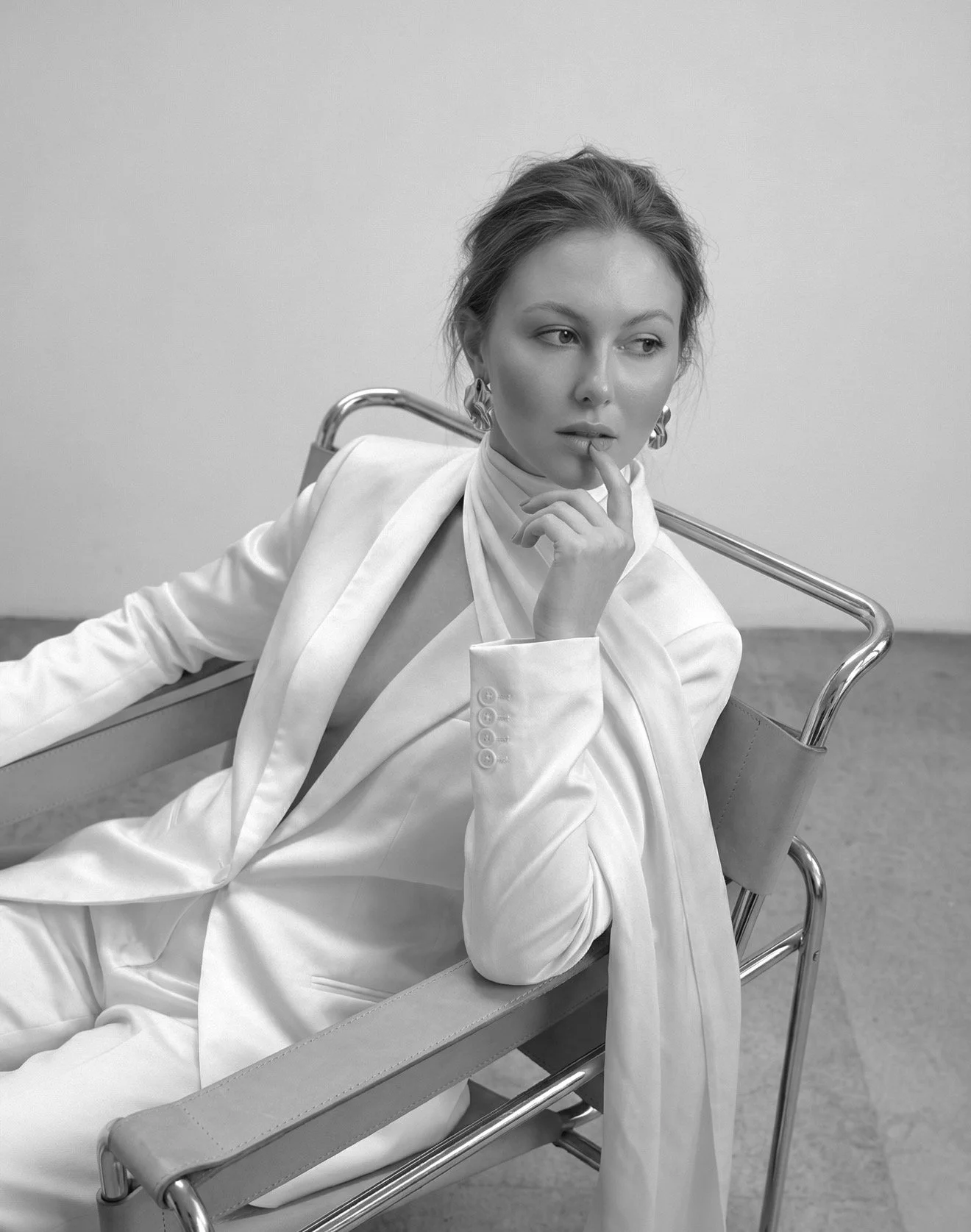 young business woman in minimalistic elegant suit working in fashion