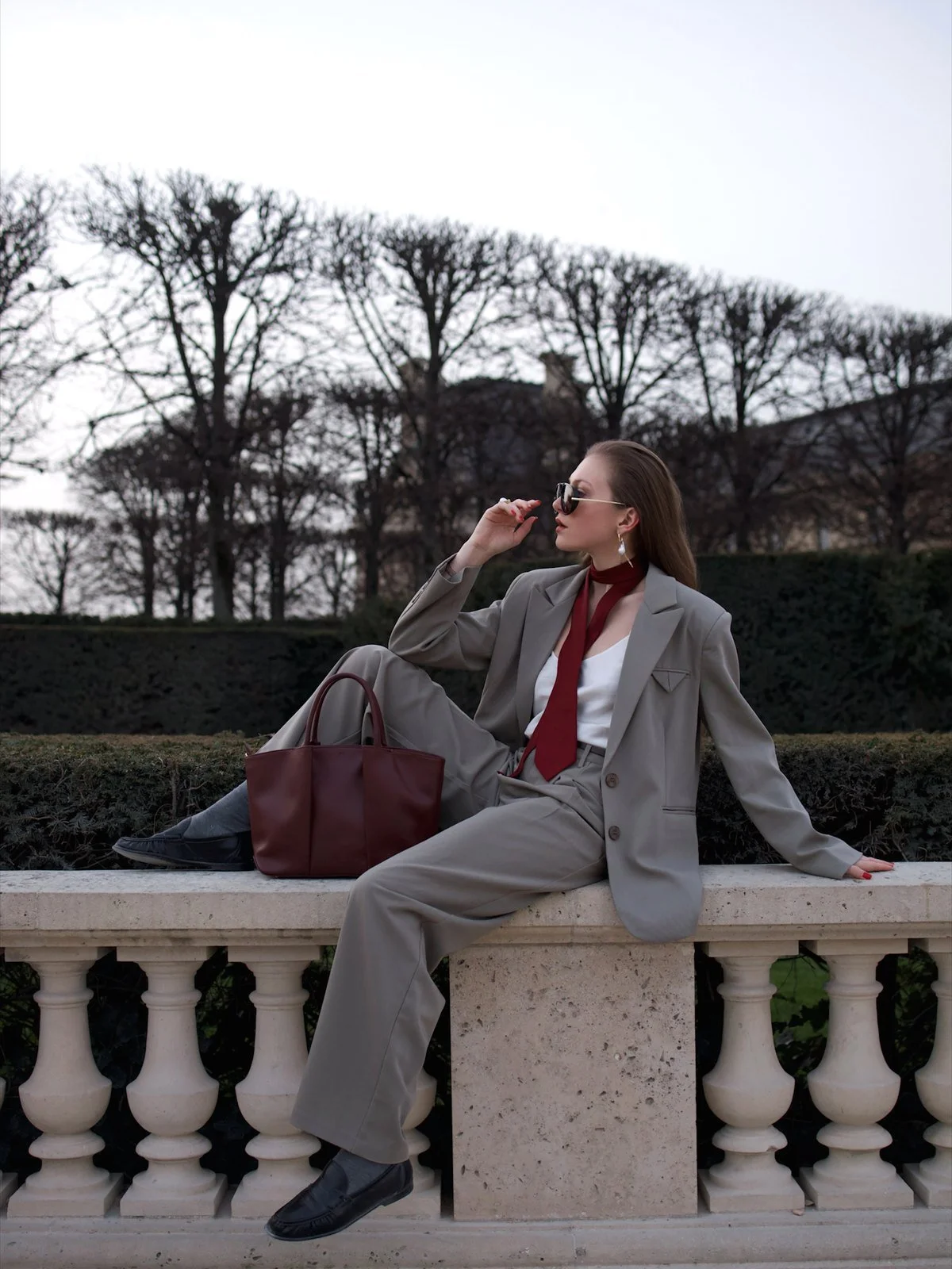 Emily Varr with a KAAI bag in the Tuileries Garden, Paris