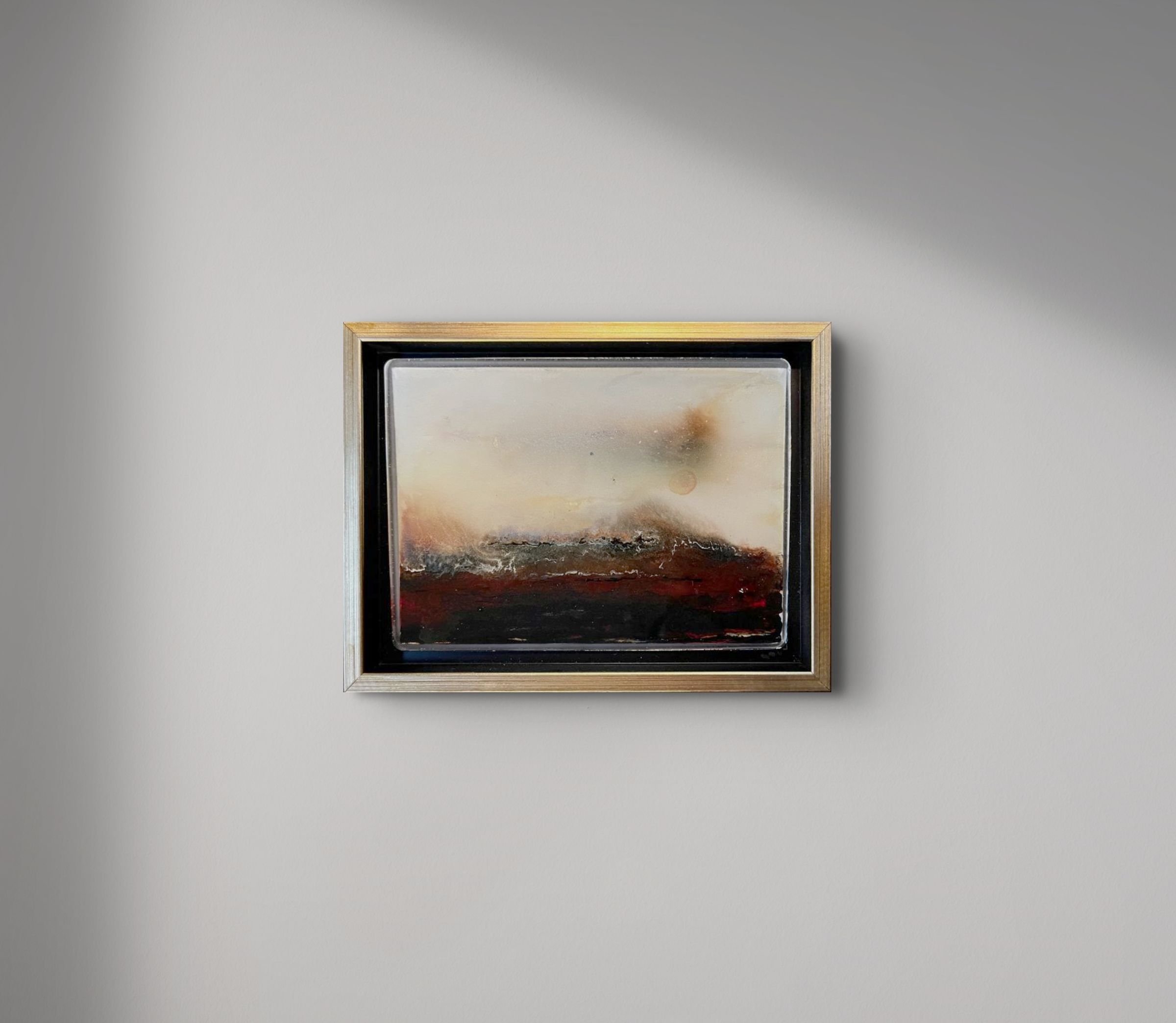 In situ installation view of No. 317 (Winter 2024) by Danny Perkins, a 6.5x8.5 inch framed oil on board with resin depicting dark burgundy and charcoal impasto fields.