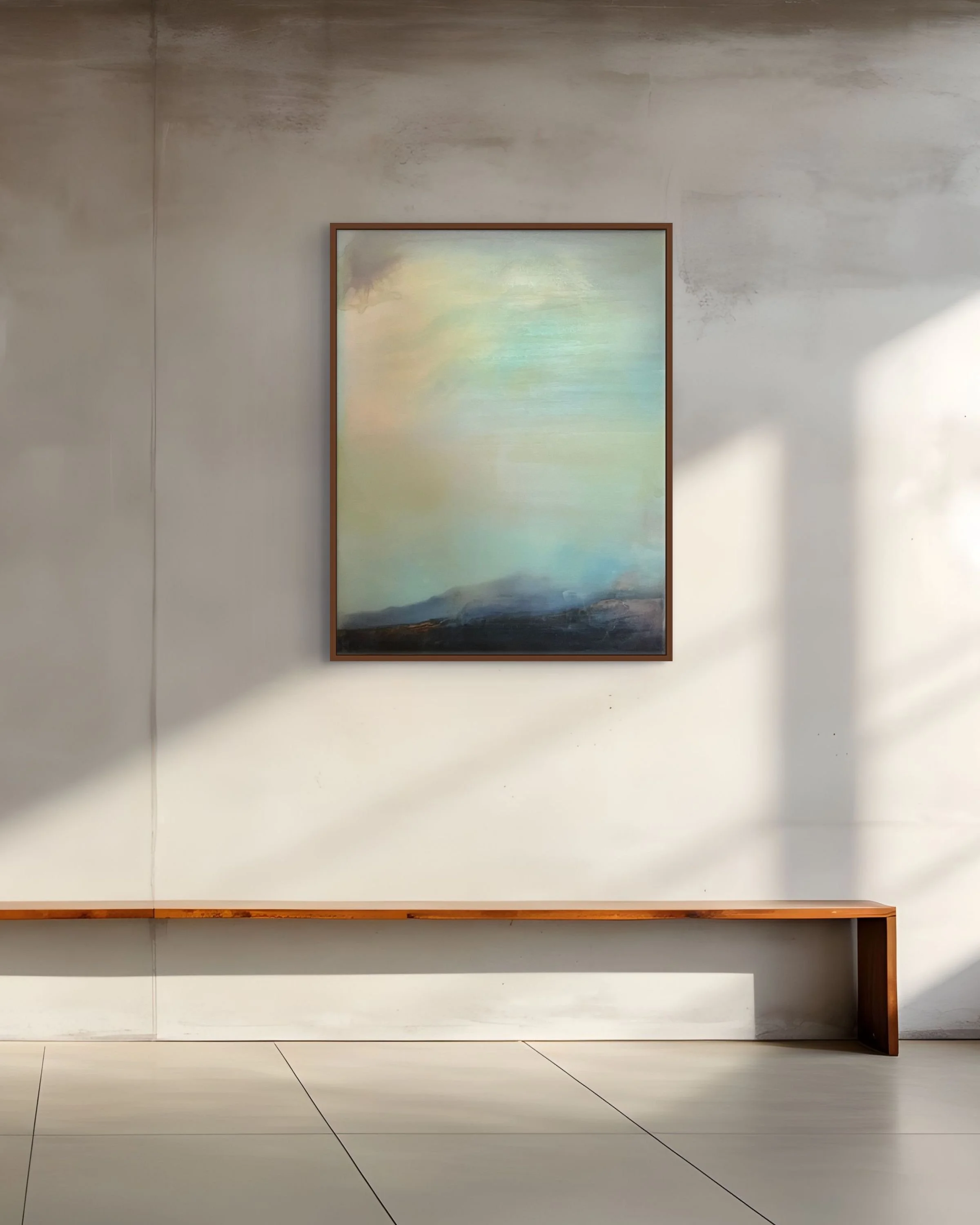 In situ view of an oil and resin panel painting by Danny Perkins, featuring atmospheric sky tones and dark indigo fields mounted on a textured plaster wall.