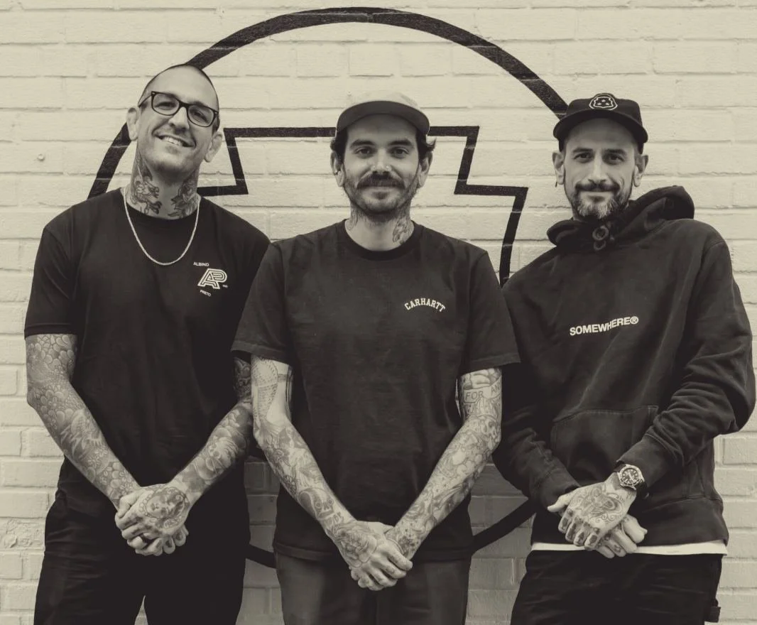 Founders Ryan Clarke, Drew Morgan and Billy Bennett in front of the shop's mural