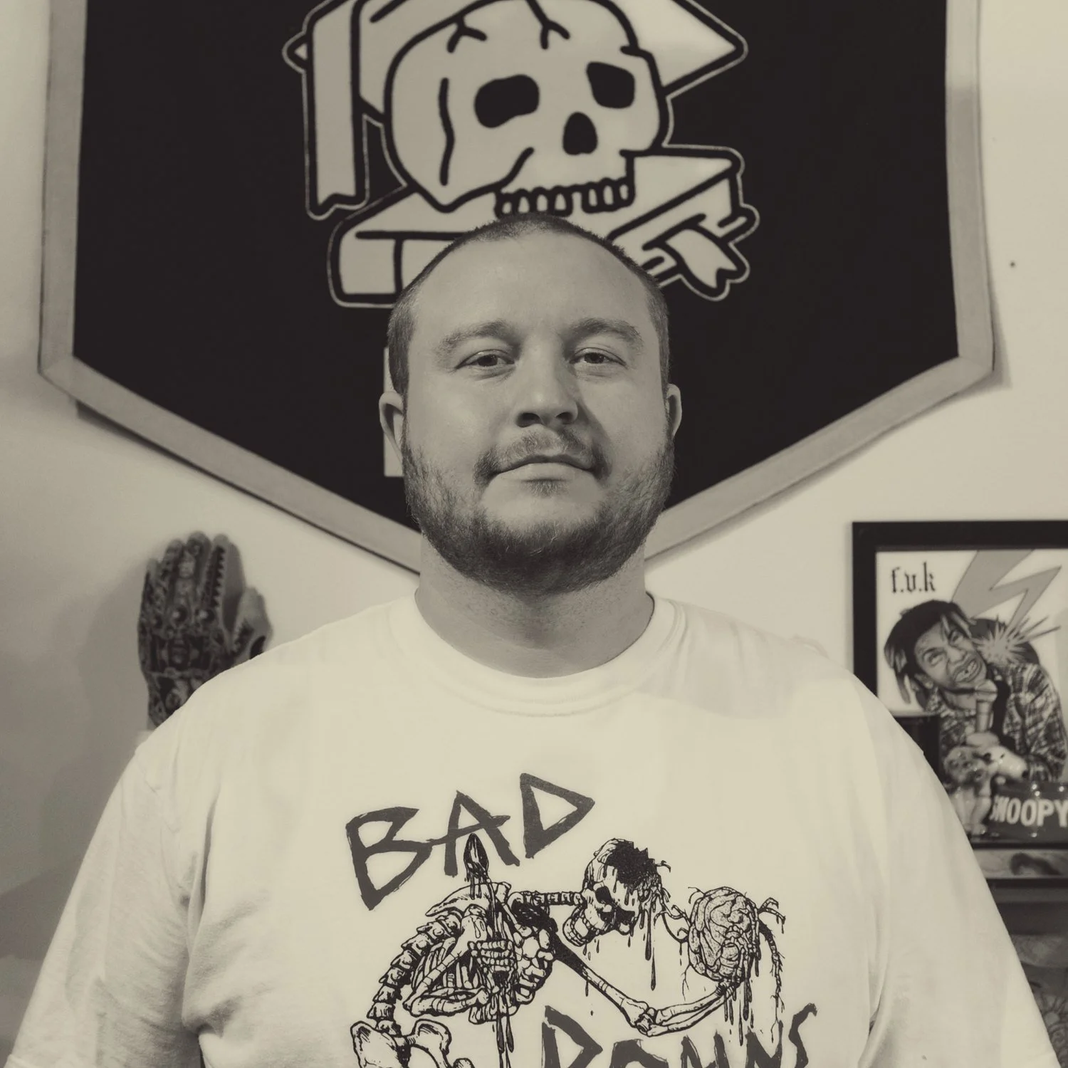 Nick Freidline in front of his pennant at the shop
