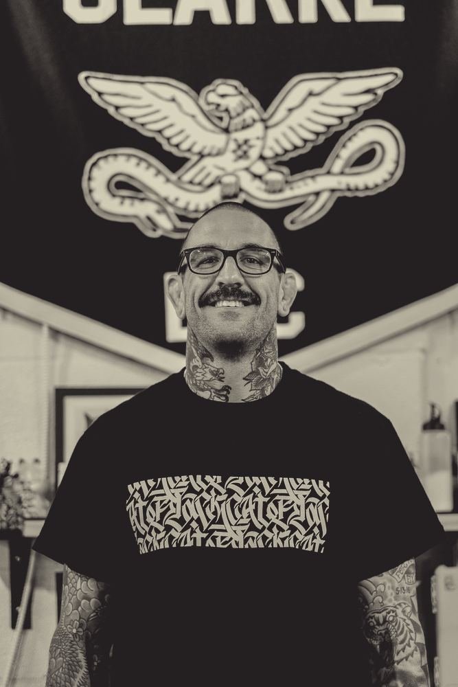 Ryan Clarke, tattoo artist at District Tattoo Co., in the shop
