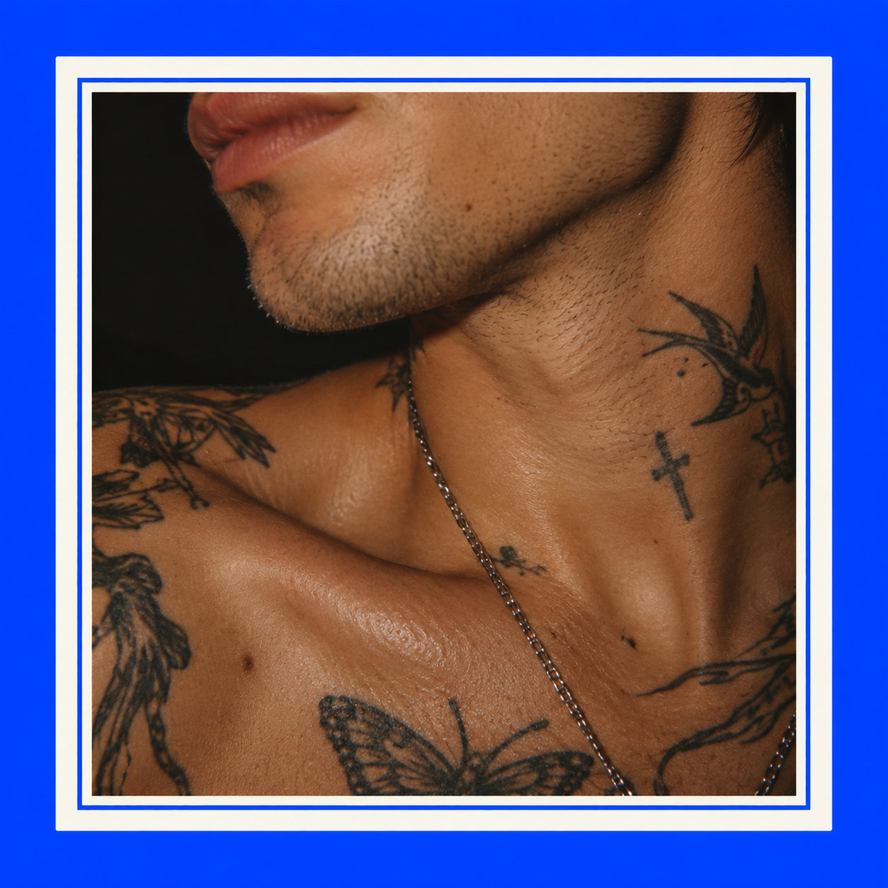 Cobalt-Framed Tattooed Portrait.png