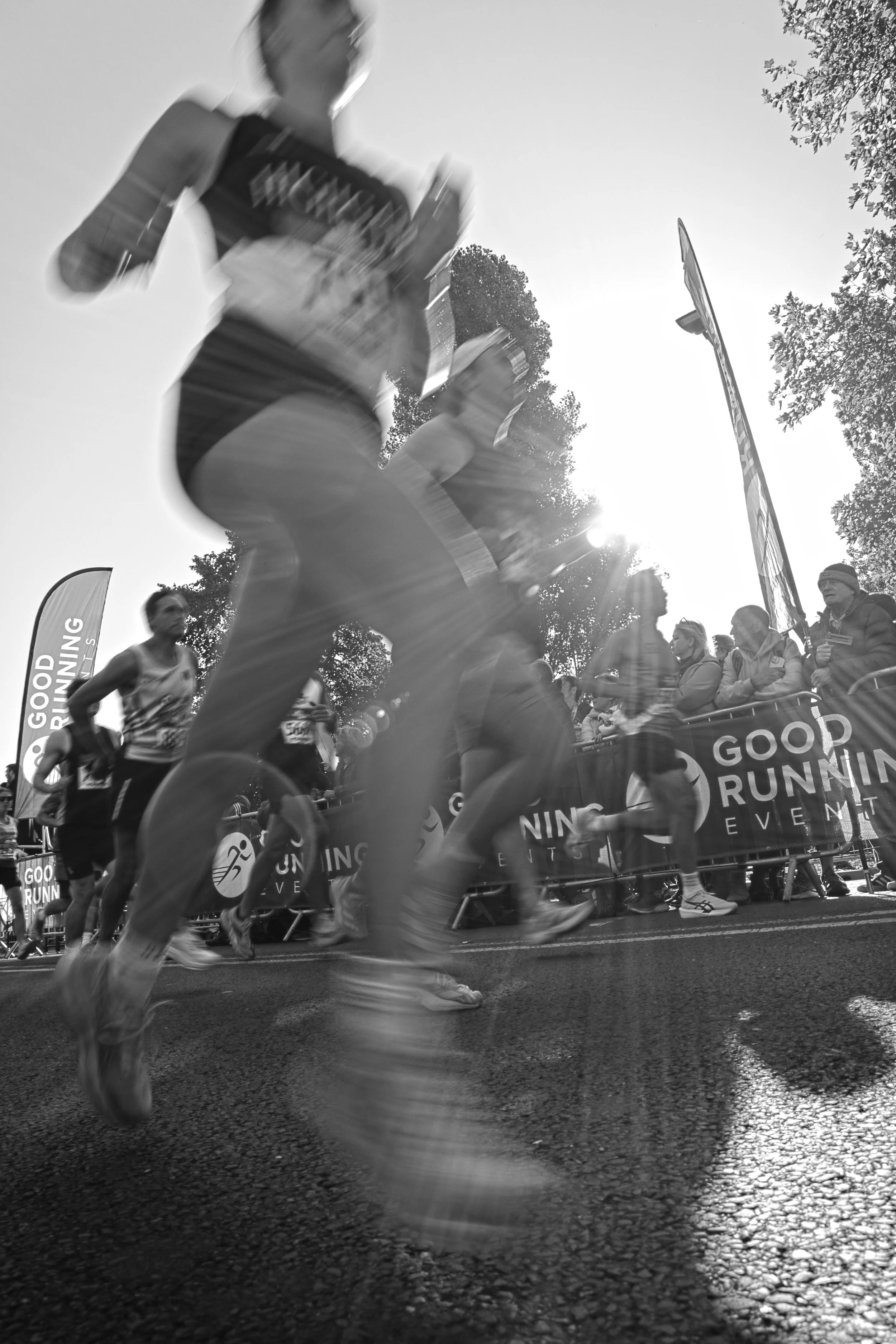 A woman running half marathon in a black and white photo