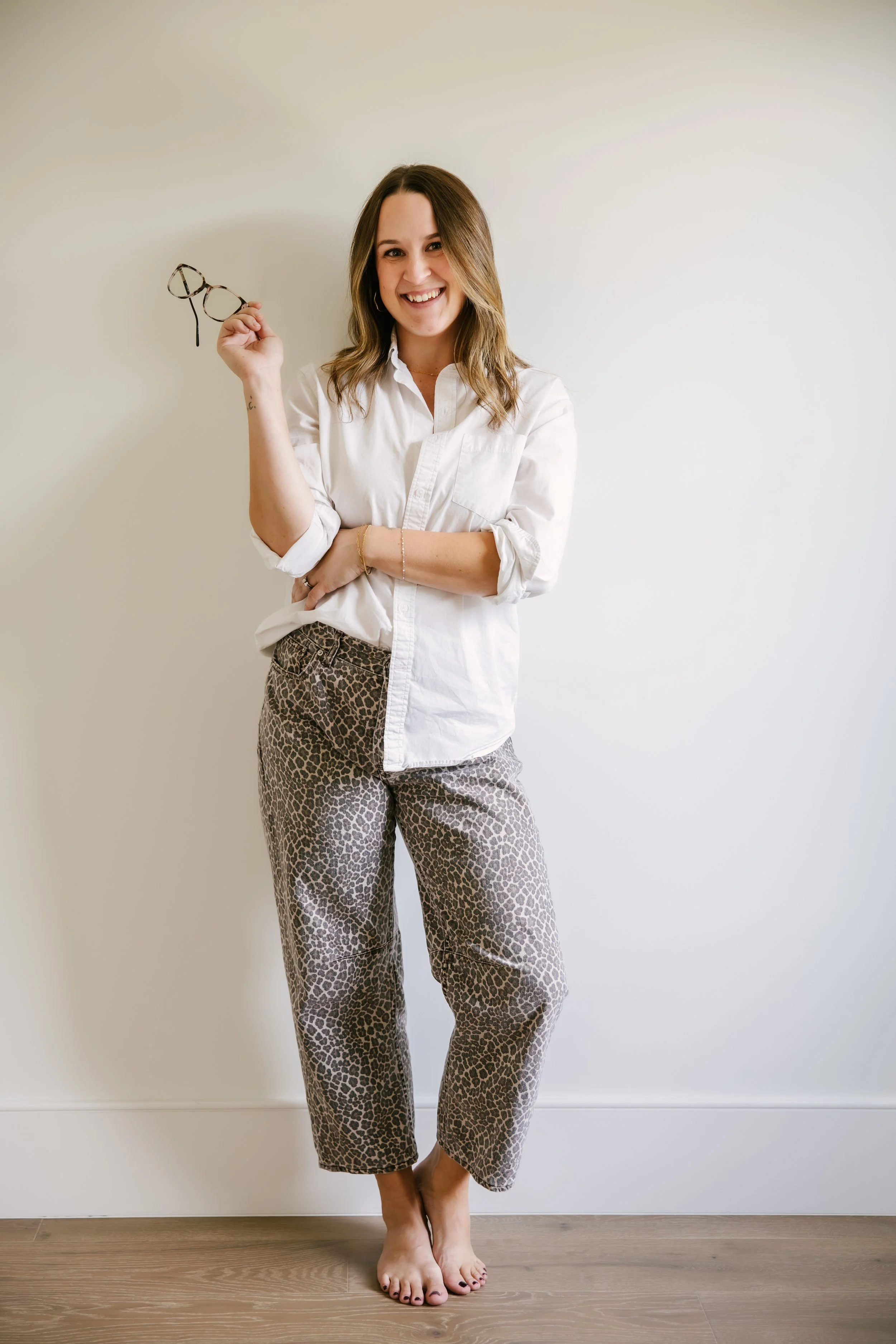 Kayla Vice, Denver real estate agent and first-time home buyer specialist, smiling and holding up house keys