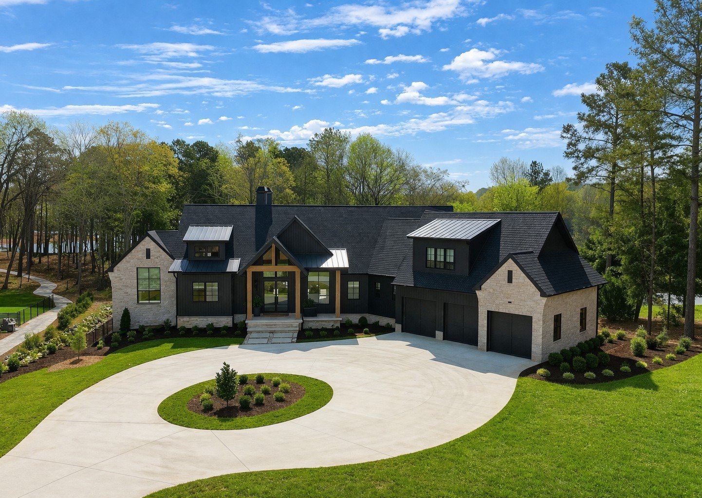 Front exterior of a black board-and-batten custom home with stone accents and a timber-framed entry