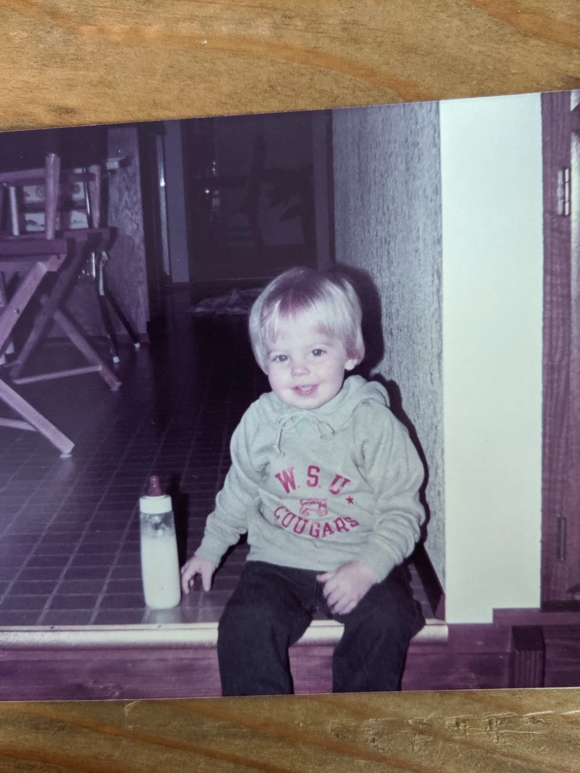 Chase as a child wearing a WSU Cougars sweatshirt.