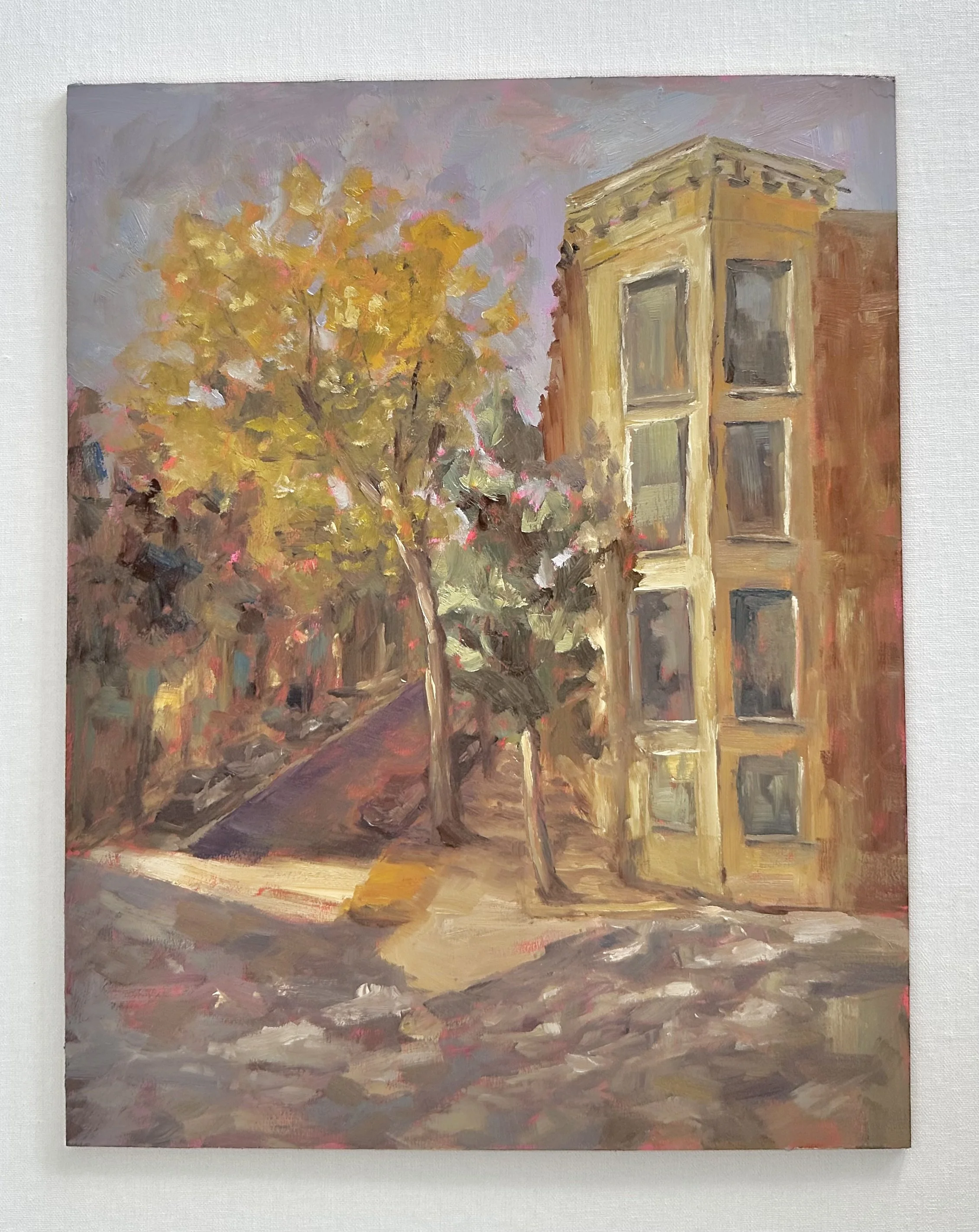 Oil painting of an autumn city street with golden trees, a narrow sidewalk, and an old brick building.