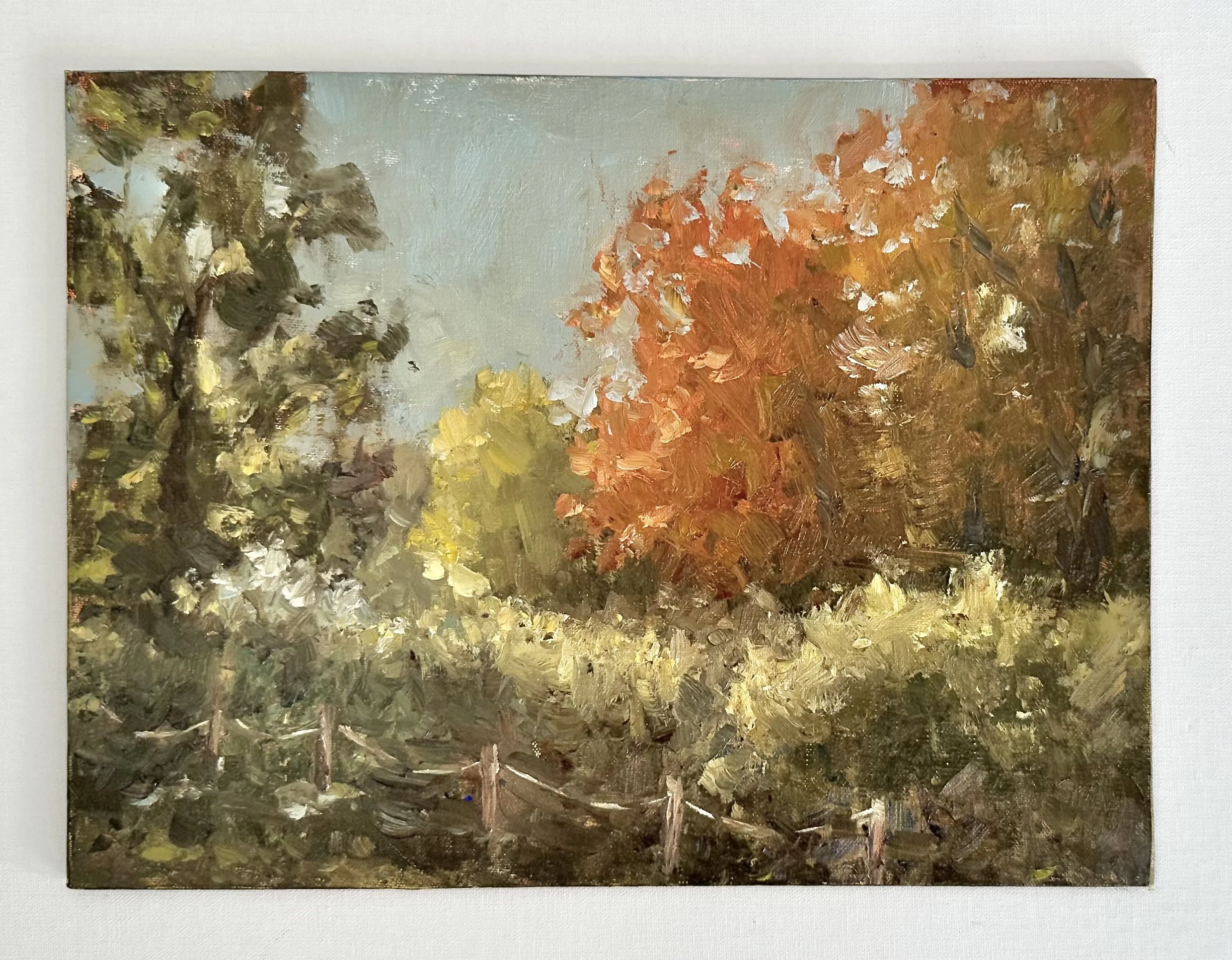 Impressionist-style painting of a sunlit autumn forest with vibrant orange, yellow, and green foliage.