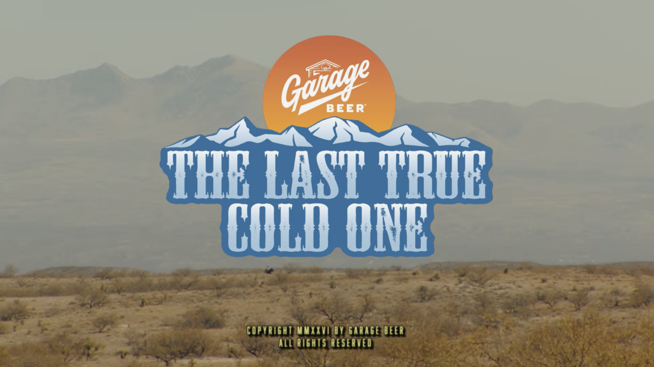 A desert landscape with mountains and a cloudy sky, featuring a logo for Garage Beer and the text 'The Last True Cold One!'