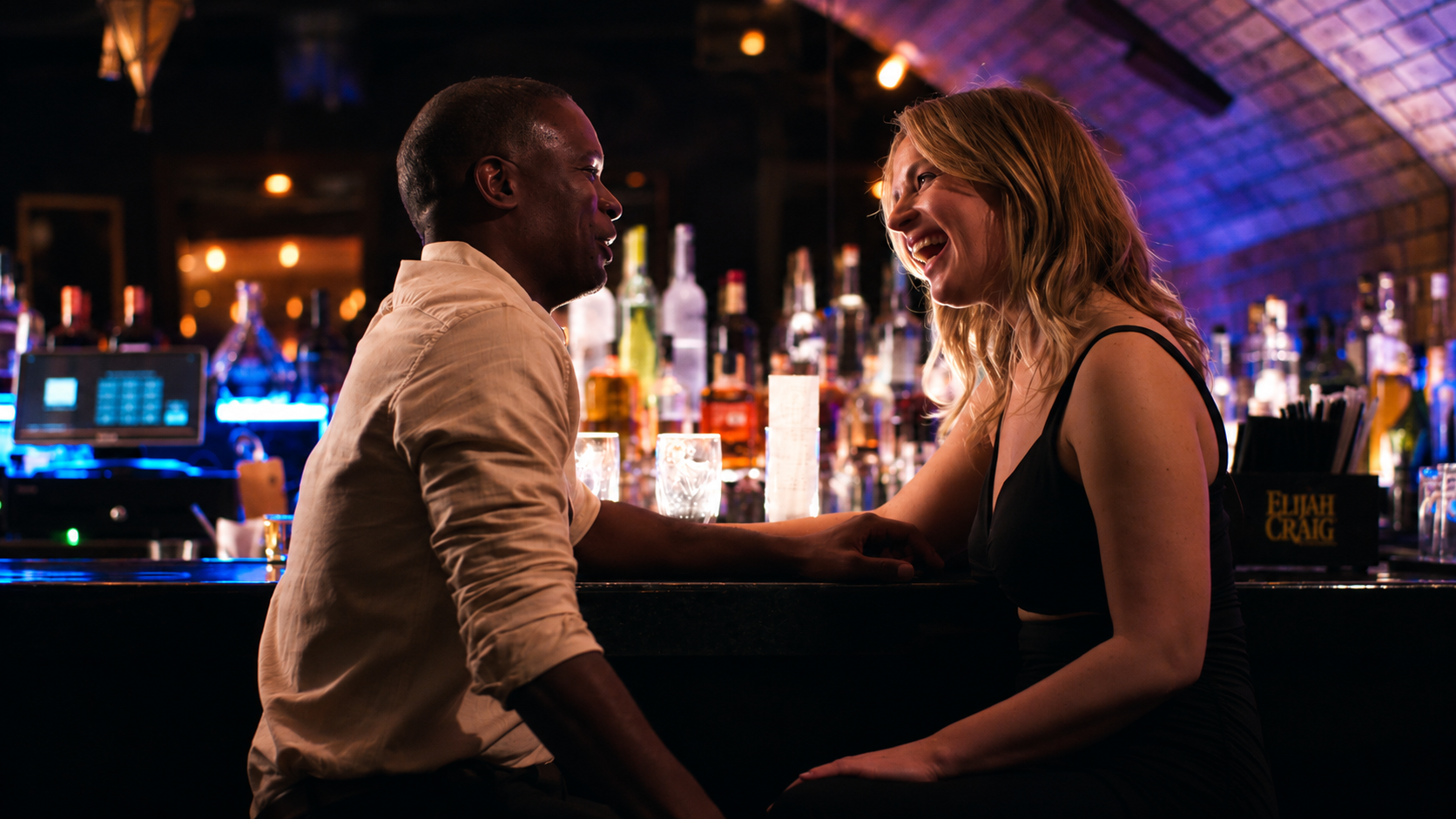 Cinematic Bar Conversation with Amber Bokeh.png