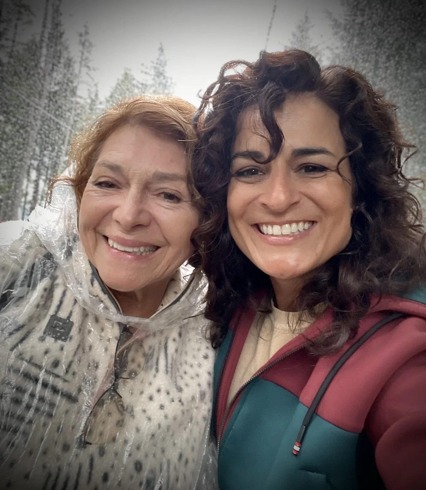 Vanessa smiling with an older family member during an autumn outing.