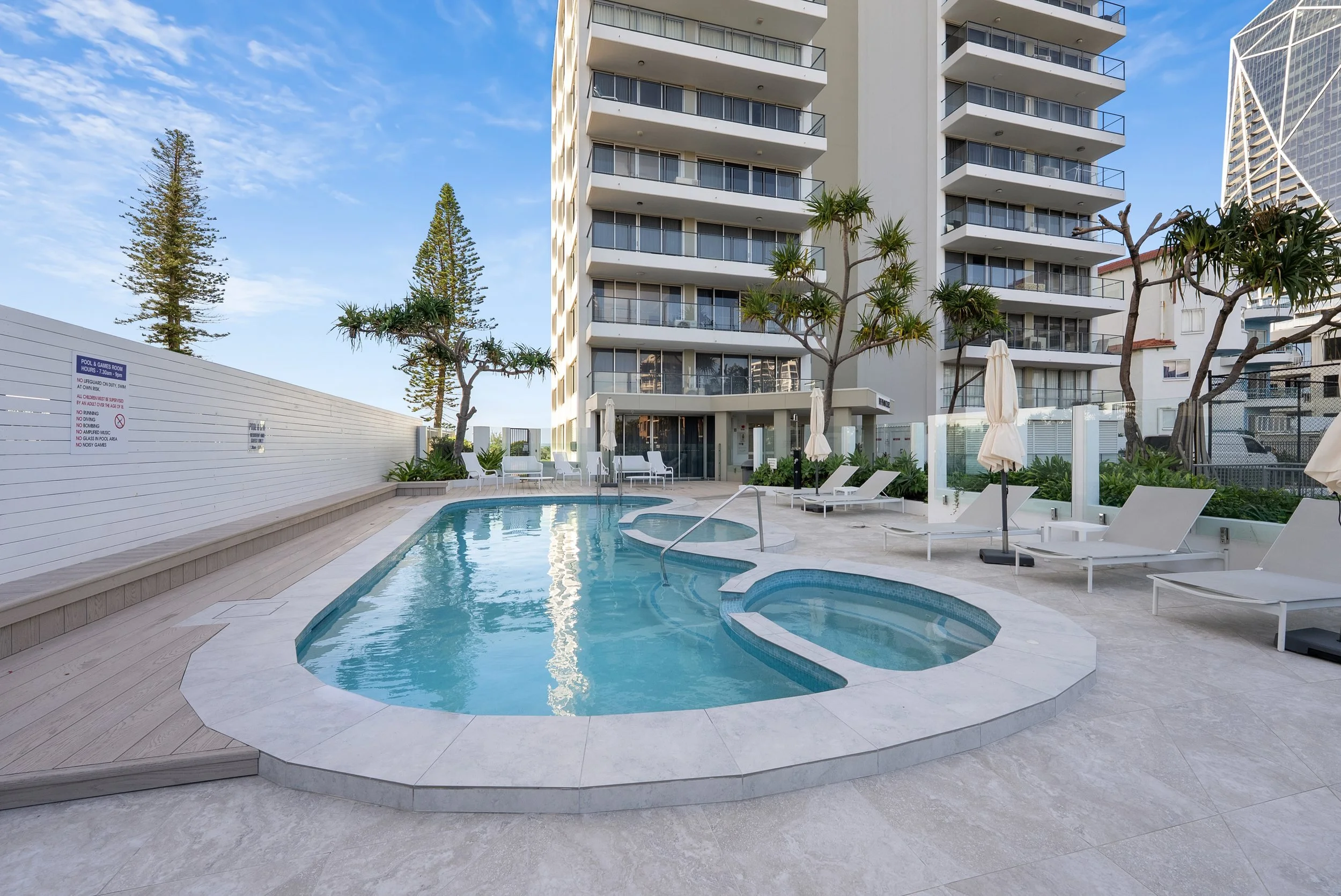 Building pool and spa with sun loungers