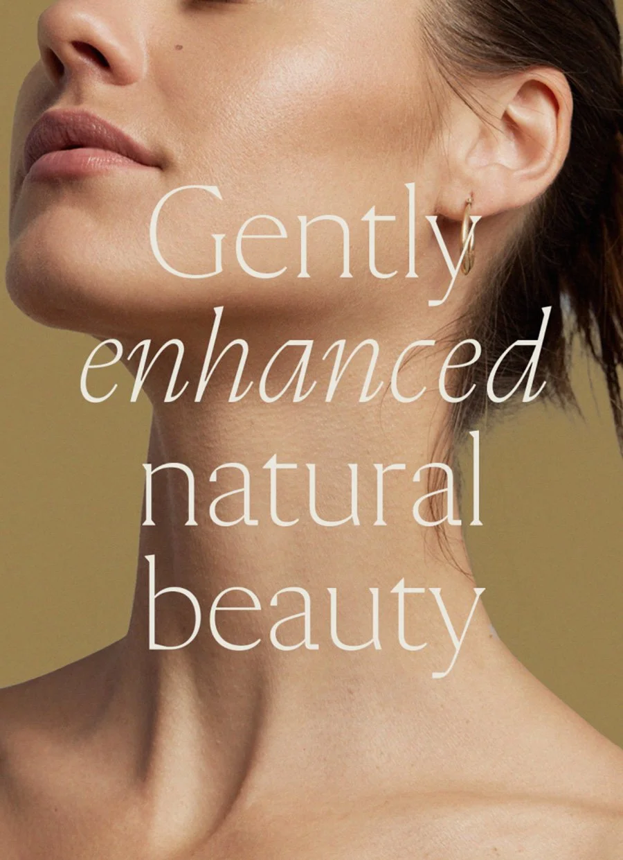 Close-up beauty portrait of a woman with natural makeup and white text reading “Gently enhanced natural beauty.”
