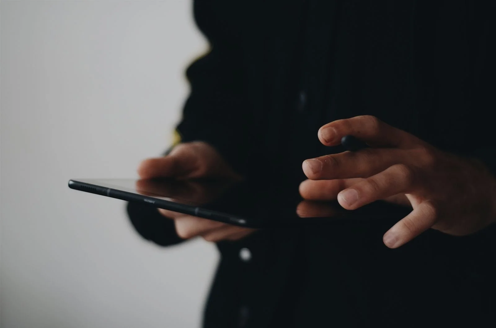 Hands using a touchscreen device