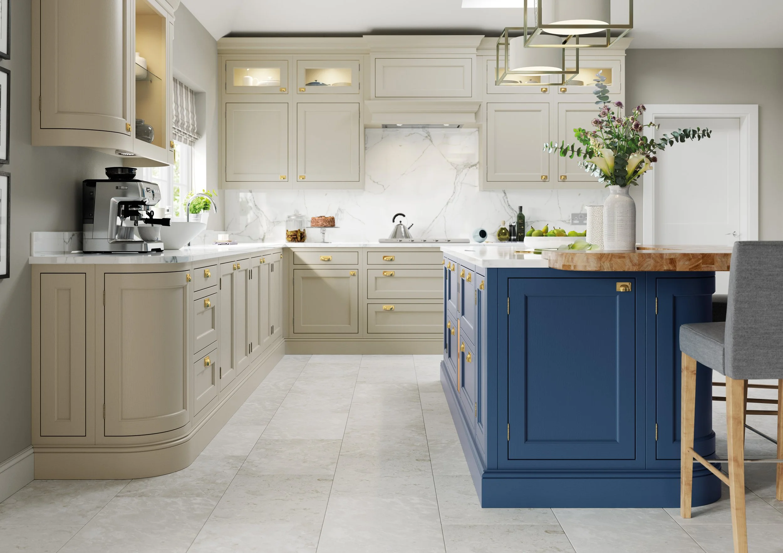 Bright traditional kitchen with cream cabinets, marble backsplash, blue island, espresso machine, pendant lights, and floral arrangement
