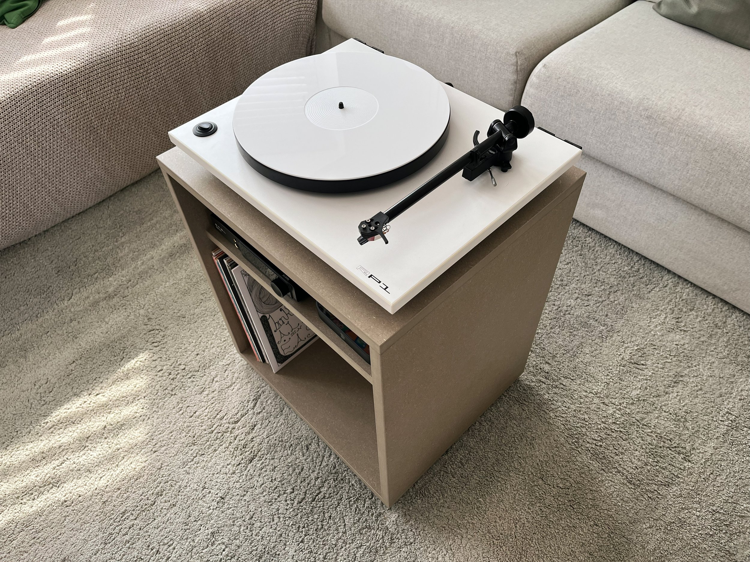 Turntable on a small table in a living room