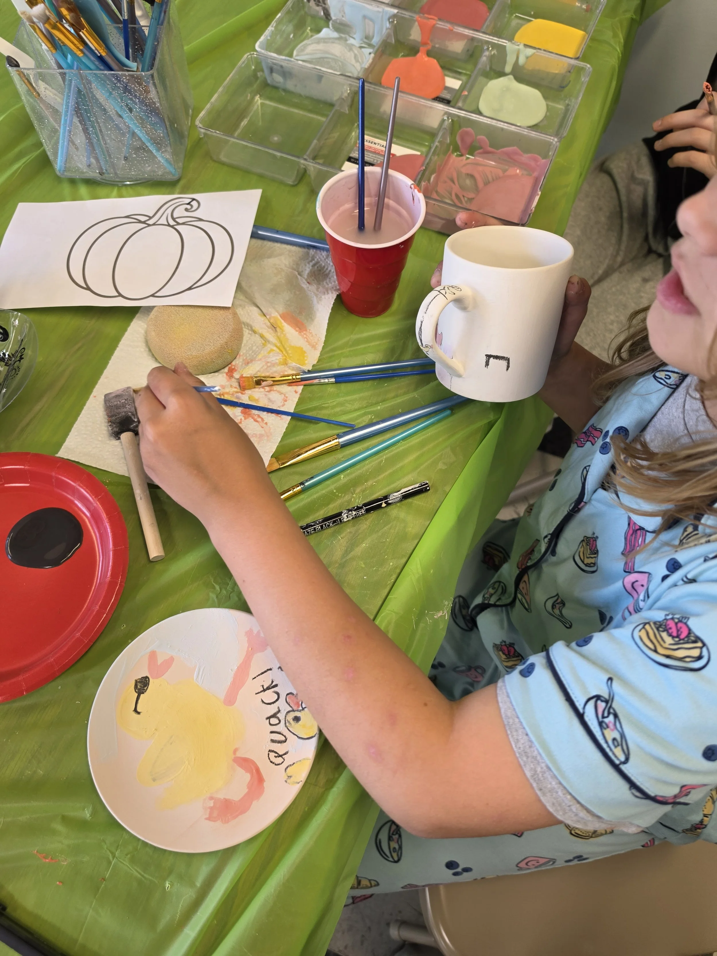our little helper glazing ceramics!