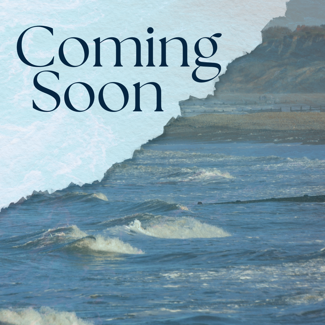 Coming soon text over a coastal ocean scene with waves and rocky cliffs