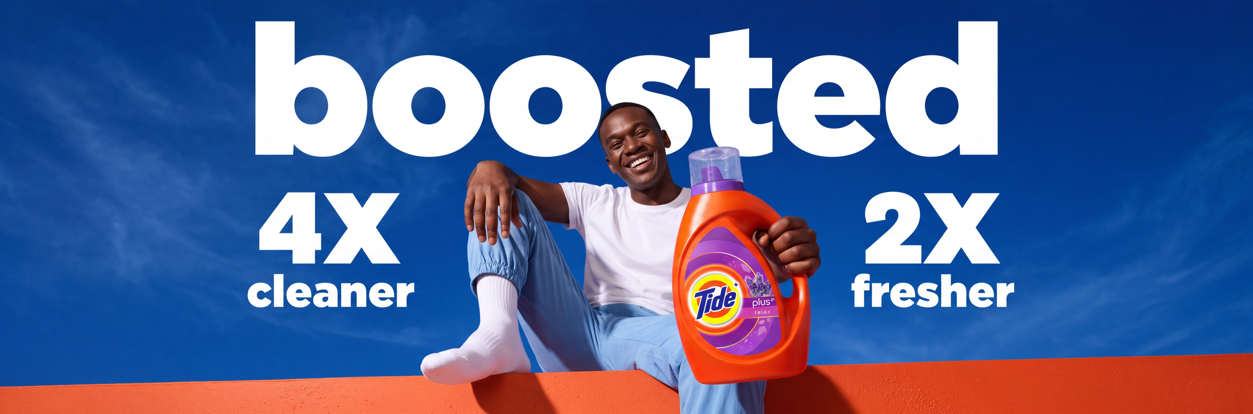 Tide laundry detergent advertisement featuring a smiling man holding a bottle with claims of 4x cleaner and 2x fresher.