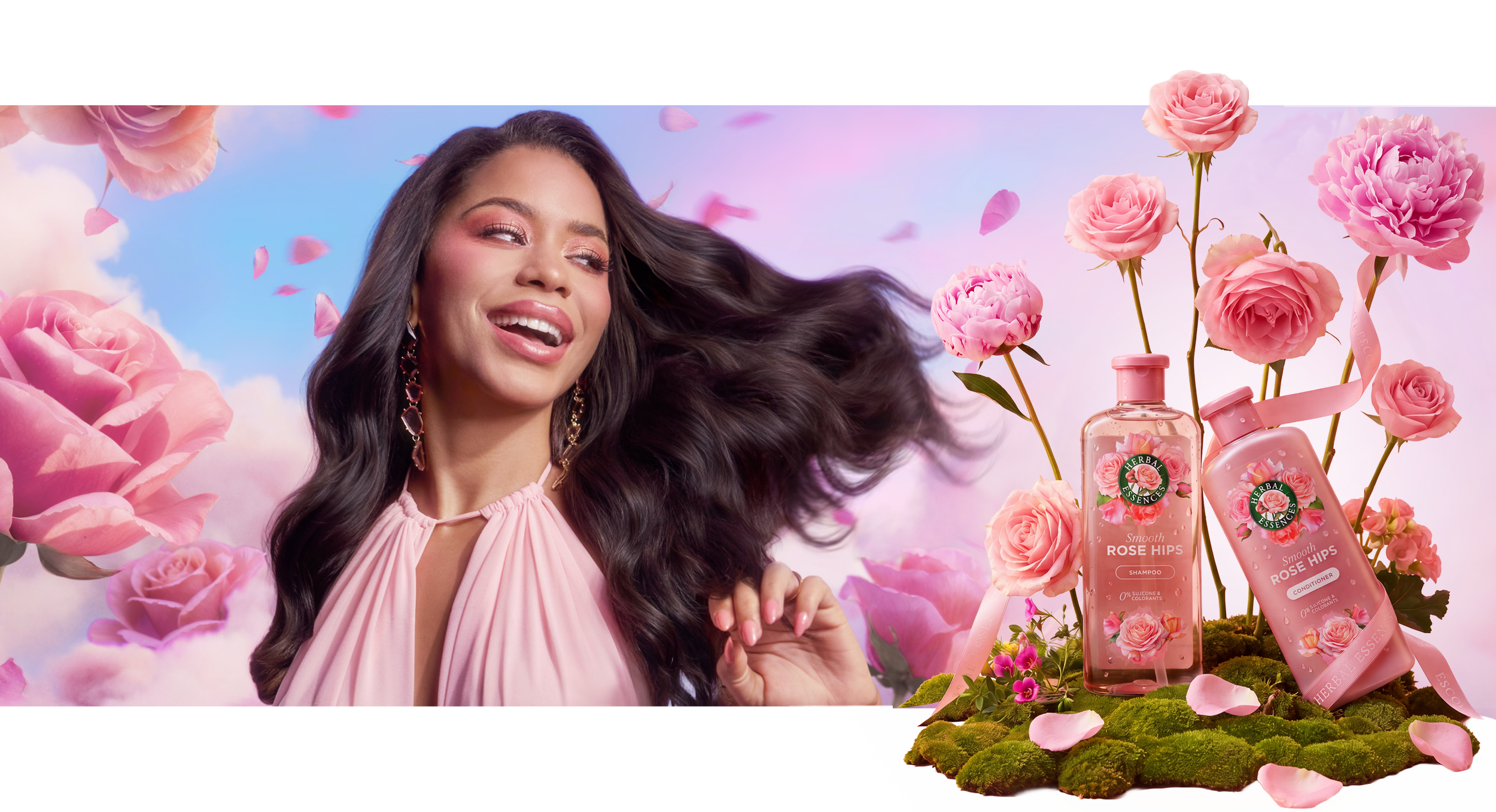 Smiling woman with flowing dark hair beside Herbal Essences Smooth Rose Hips shampoo and conditioner bottles surrounded by pink roses