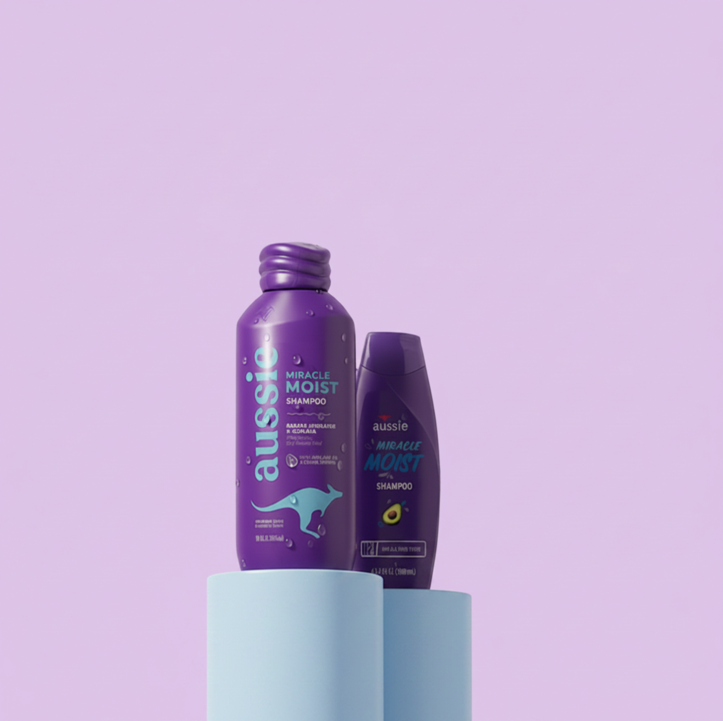 Aussie Miracle Moist shampoo bottles displayed against a lavender background