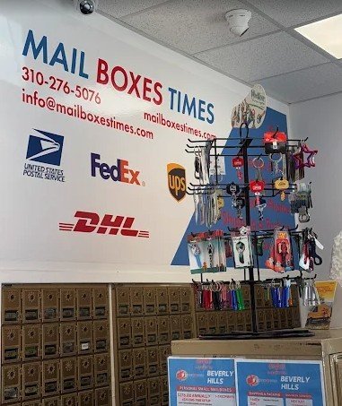 Inside Mail Boxes Times: private mailboxes, key display and carrier logos on the wall