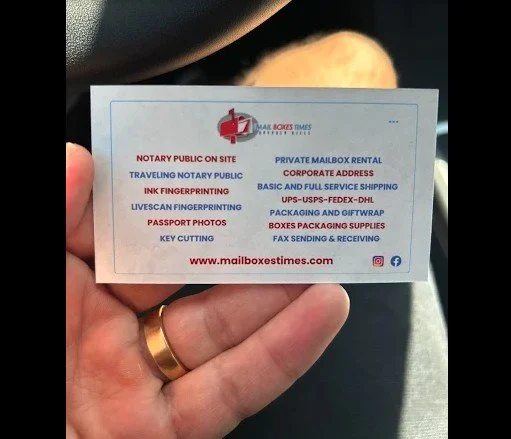 Mail Boxes Times business card listing notary, fingerprinting, mailbox rental and shipping services