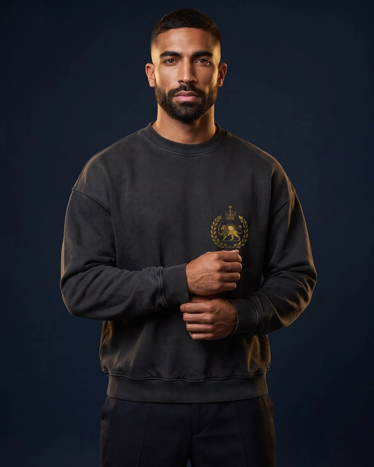 Lion and Sun – The crowned emblem in gold on heavyweight black.