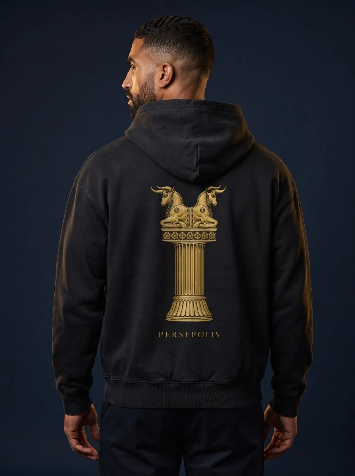 Persepolis Hoodie · €99 – The column with its twin-bull capital, in gold on 440 GSM cotton.