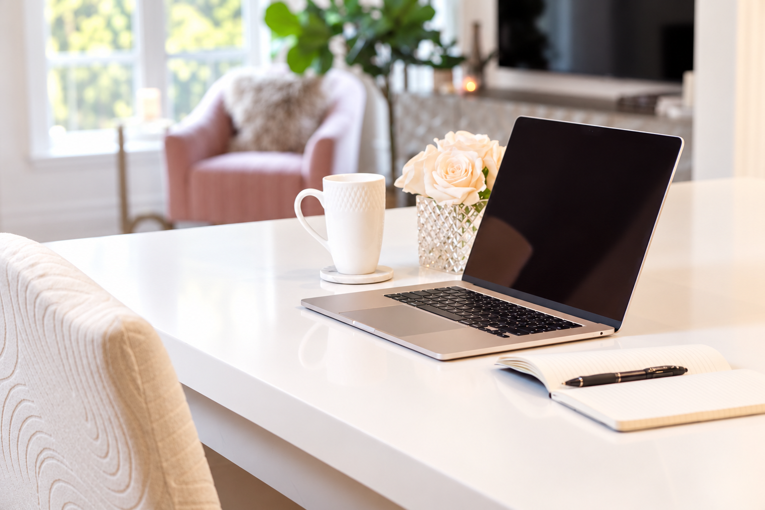 Laptop, notebook and coffee cup arranged for a virtual psychology session.