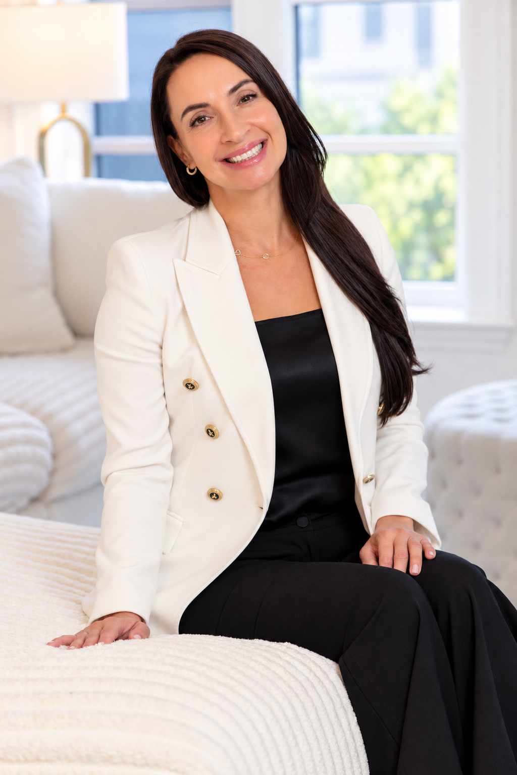 Dr. Oksana Gravets smiling in a bright professional setting.
