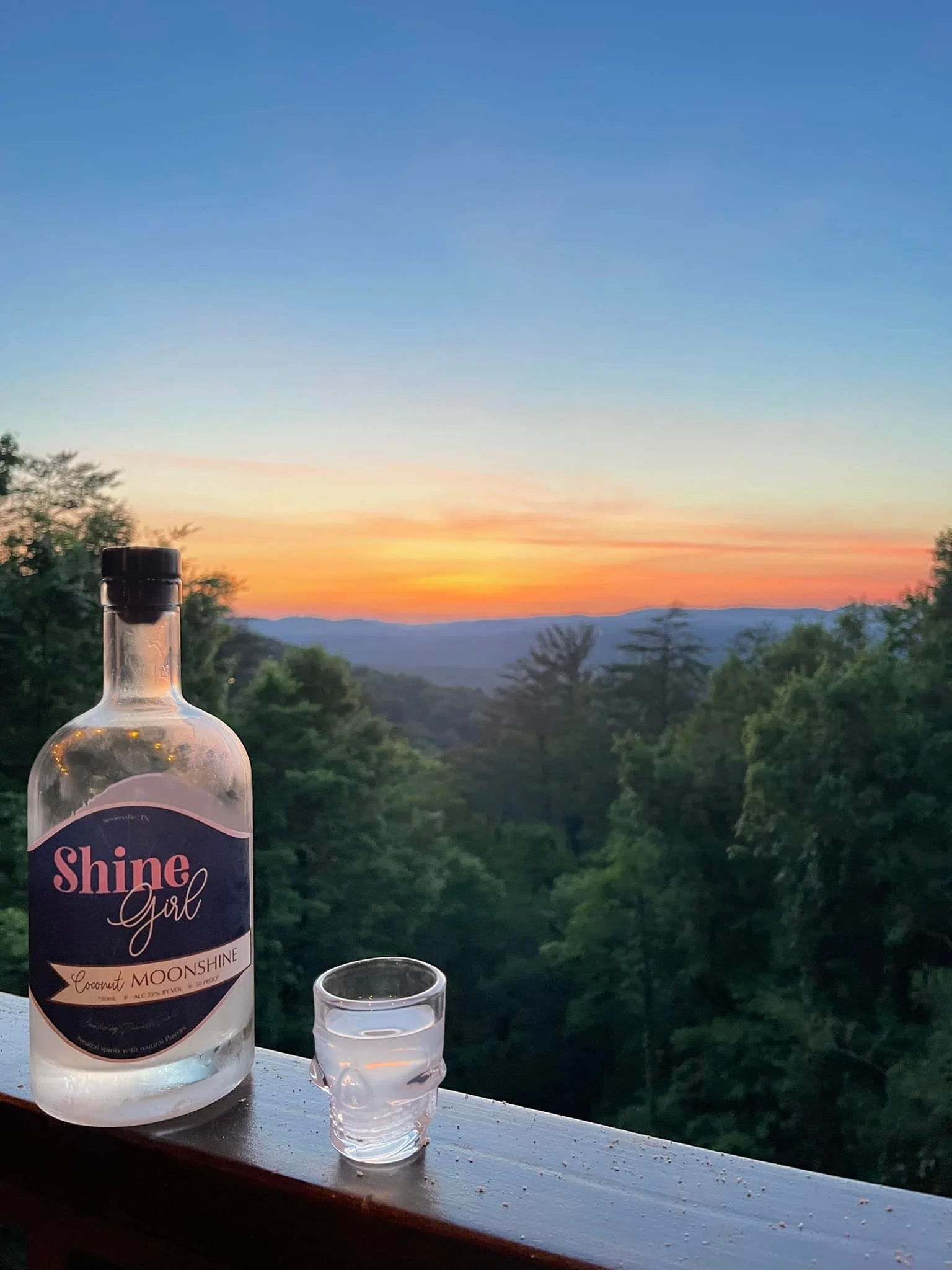 shine girl moonshine overlooking smokey mountains