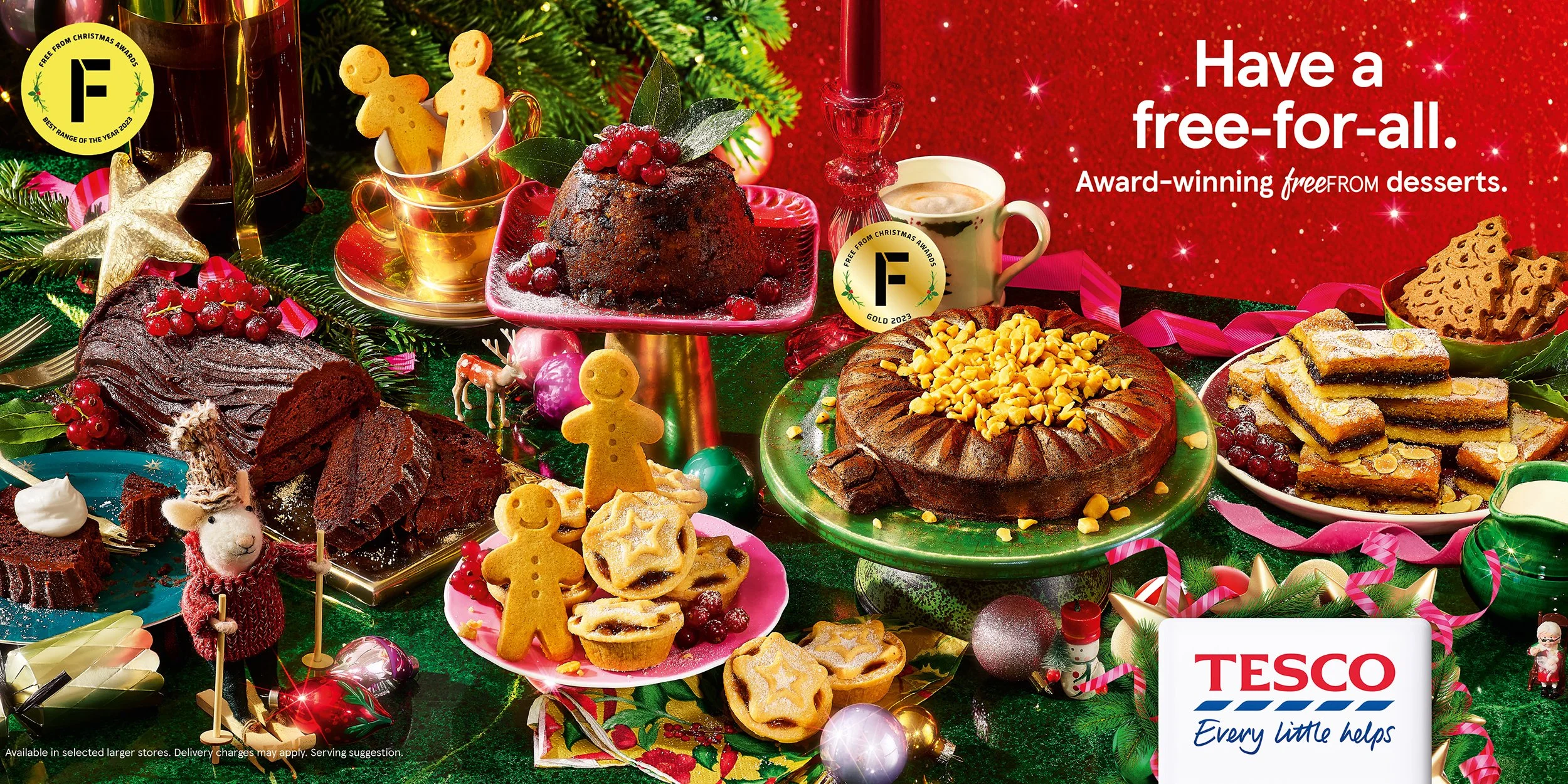 Festive Tesco Christmas dessert advertisement featuring Christmas pudding, yule log, mince pies, gingerbread cookies, fruitcake, pastries, festive decorations, and the text “Have a free-for-all.”