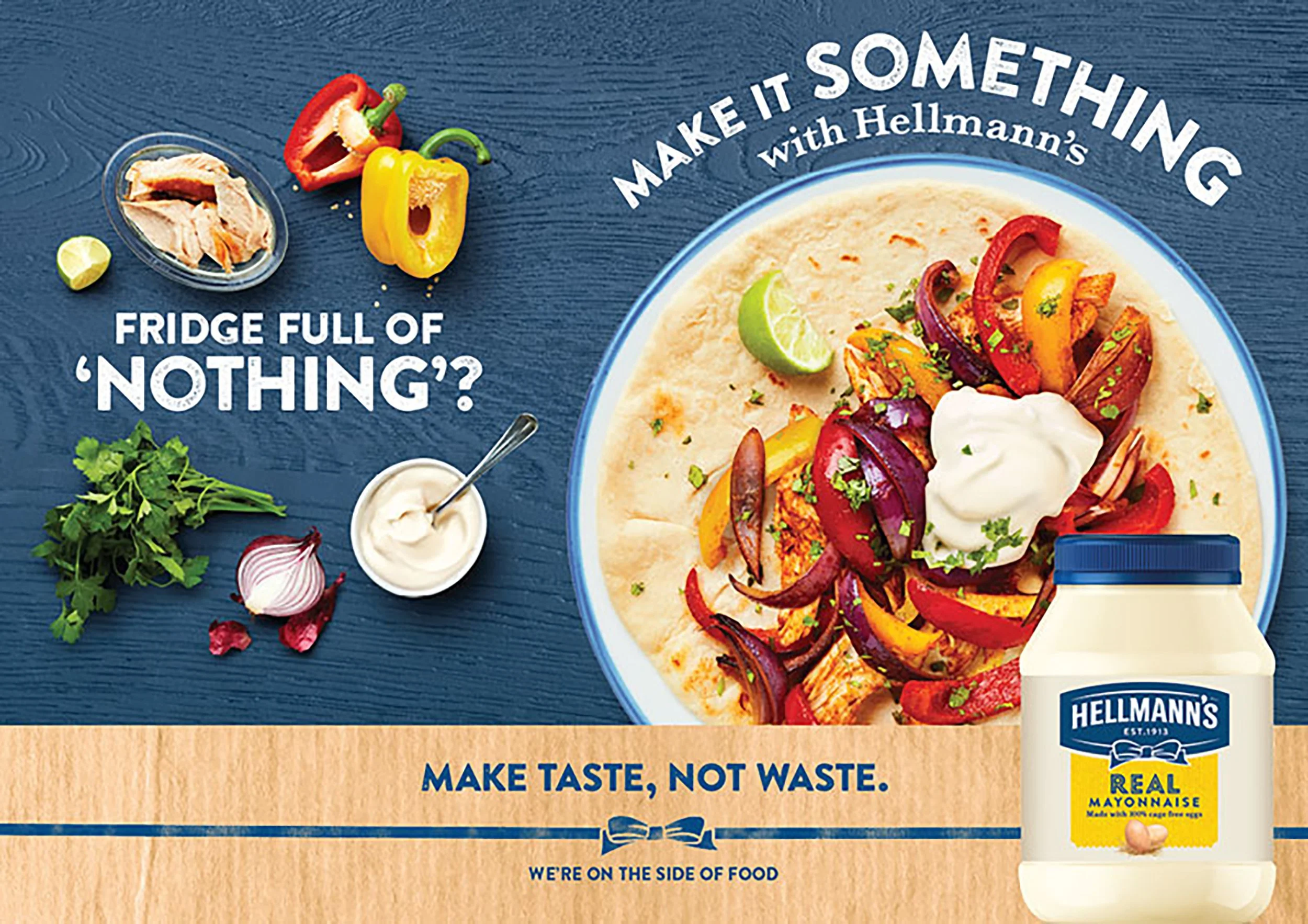 Hellmann’s mayonnaise advertisement featuring a colorful chicken and roasted vegetable tortilla wrap, fresh ingredients, and the slogan “Make it something”.